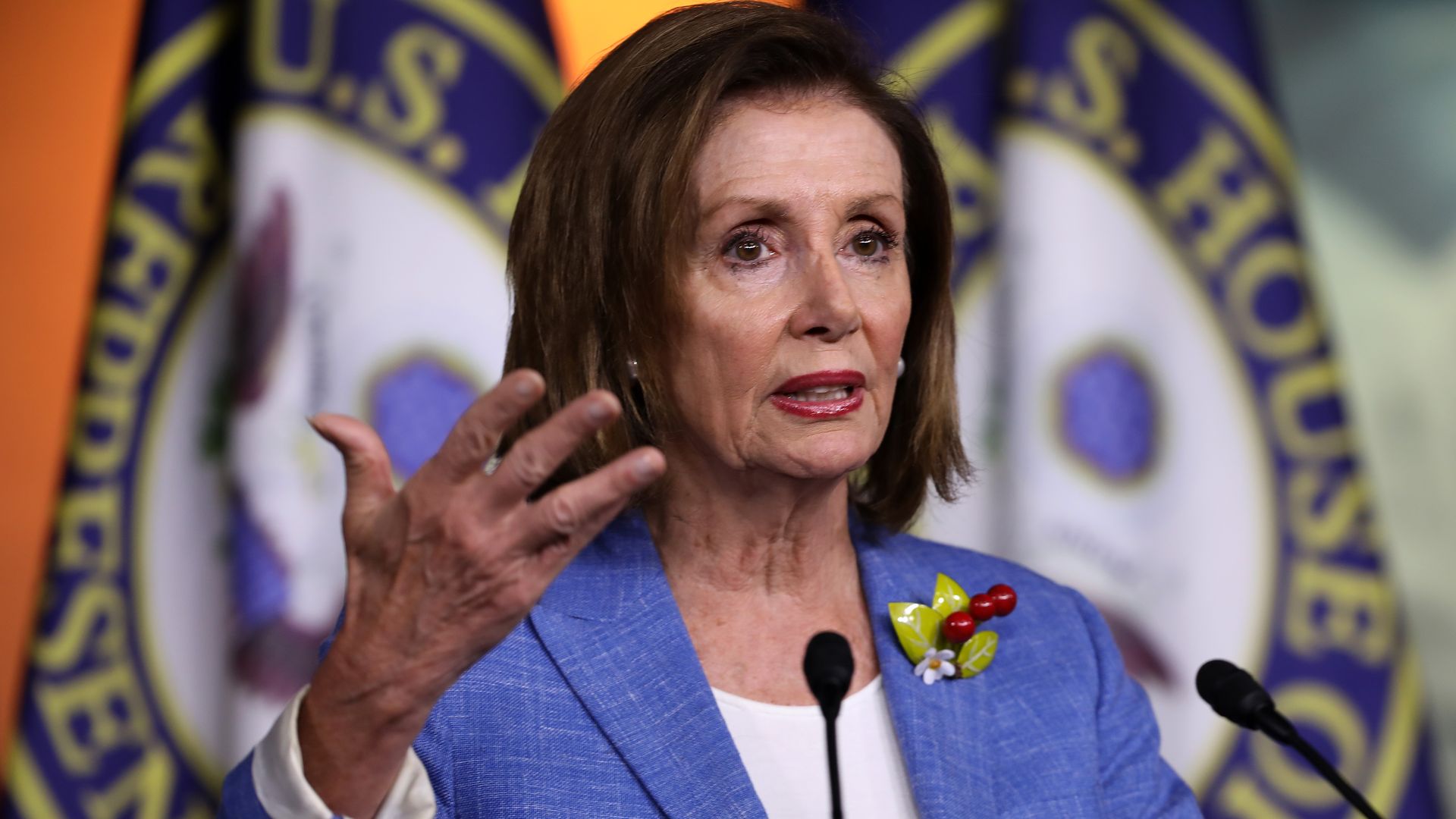 Nancy Pelosi gesturing with her hand. 