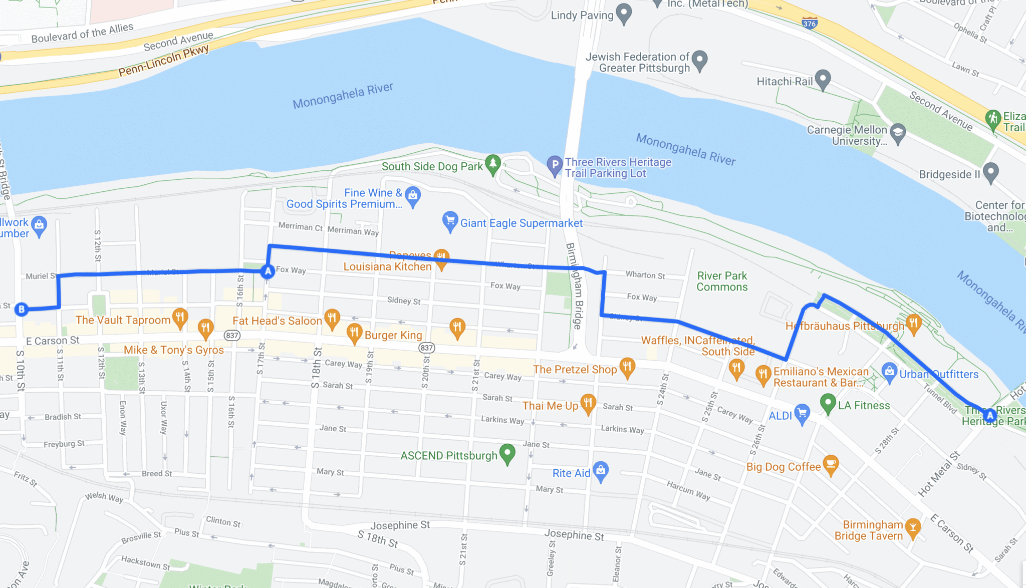 Map of Pittsburgh's South Side showing a blue route from A near Fox Way to B near E Carson Street, crossing the Monongahela River via the Birmingham Bridge.