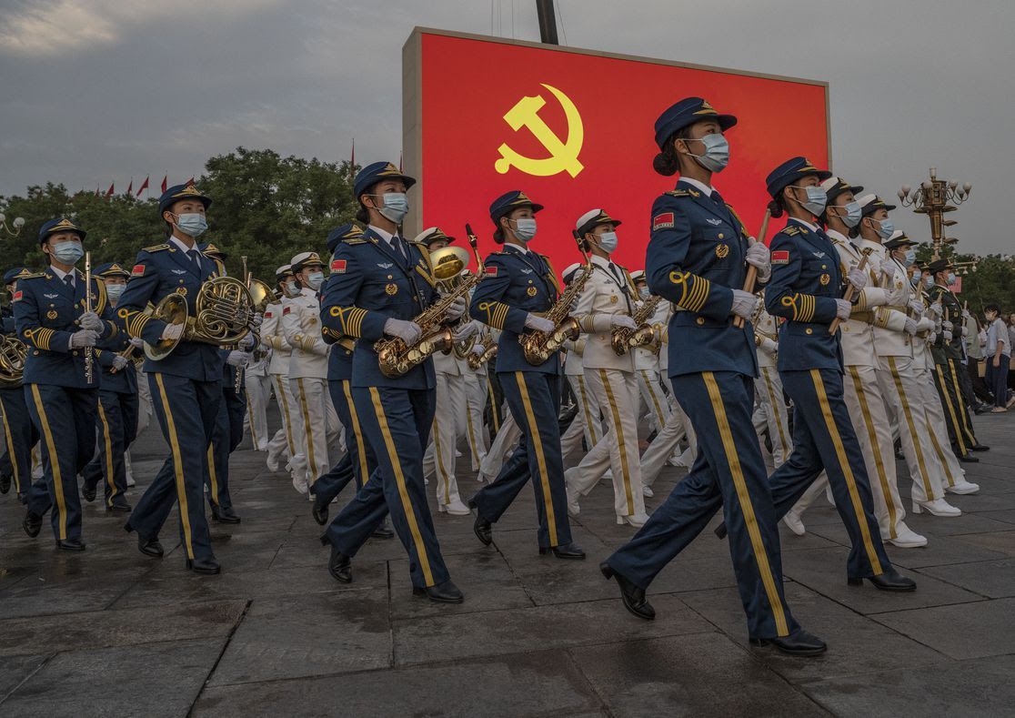 Members of a People's Liberation Army ceremonial band march in Tiananmen Square. Photo: Kevin Frayer/Getty Images