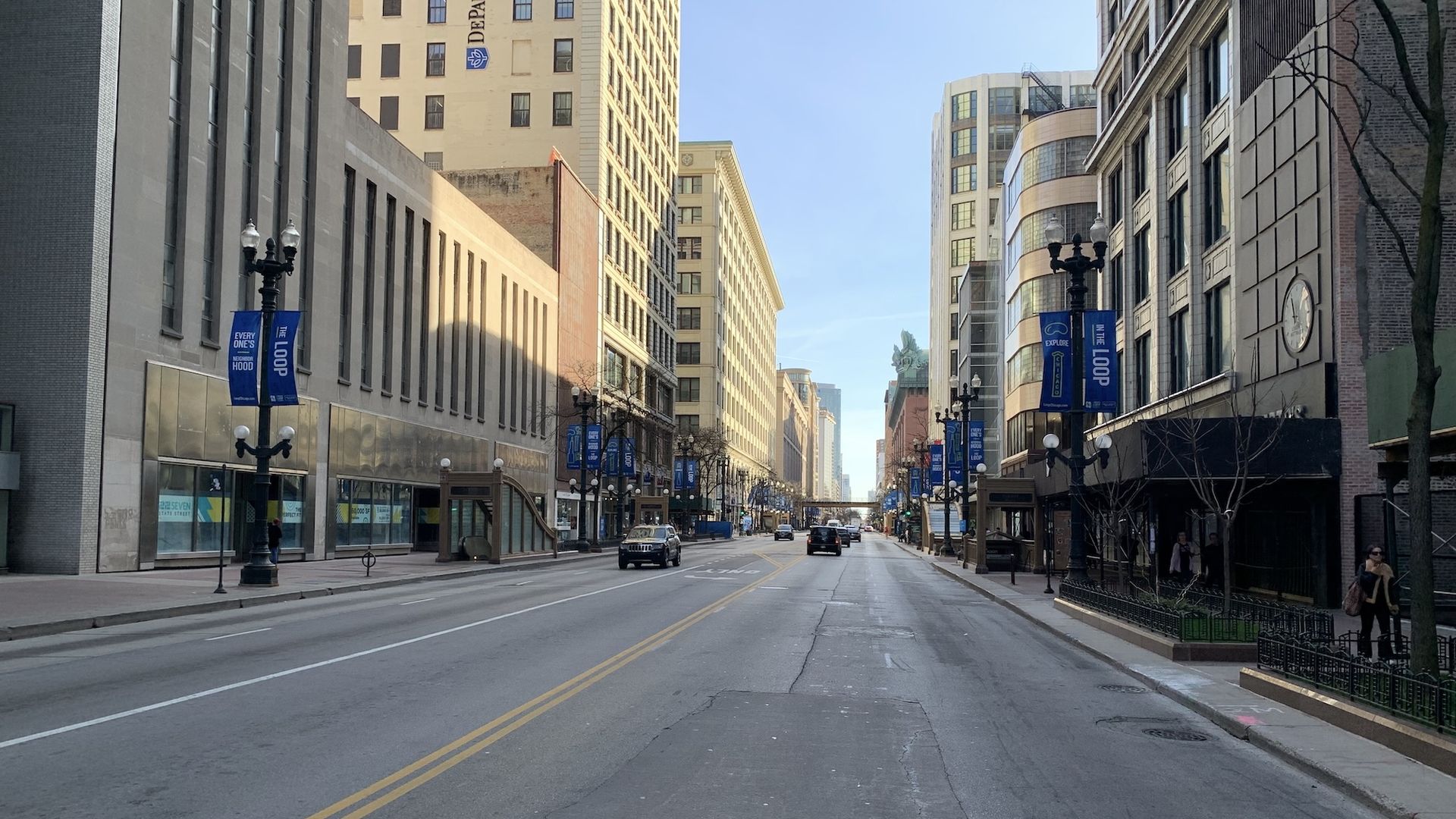 State Street in middle of buildings with a few cars.