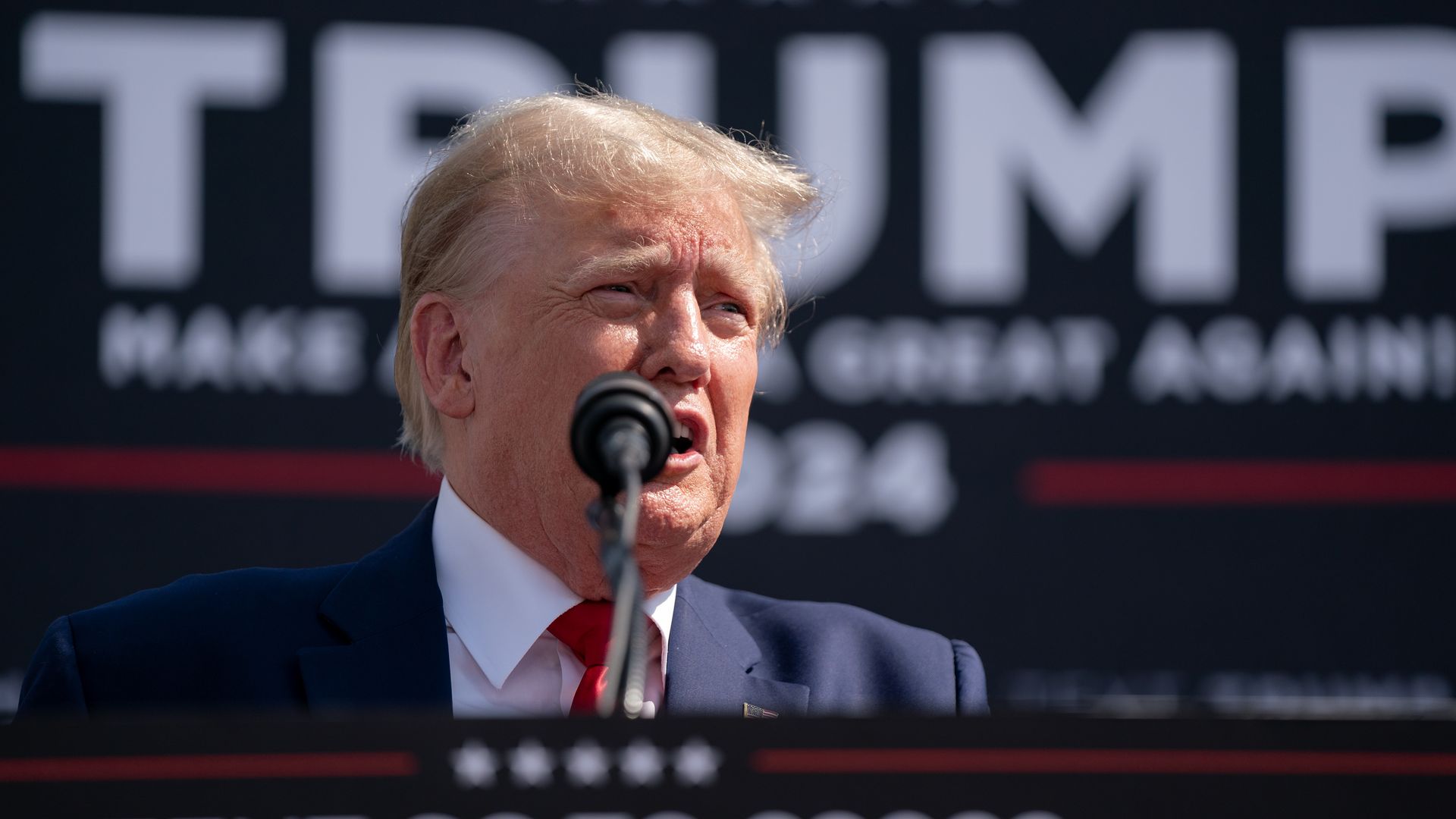 Donald Trump at a mic