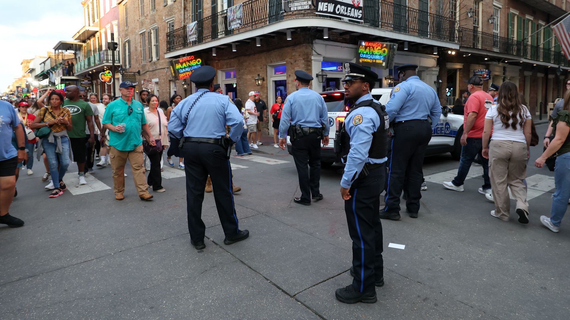 Photo shows police officers in the street.