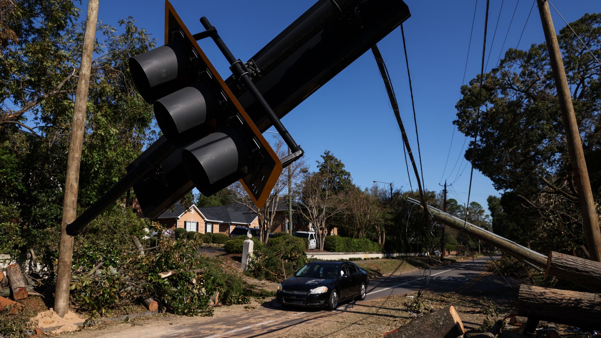 Traffic passes by a broken street light in Augusta, Ga., on Wednesday, October 2, 2024.