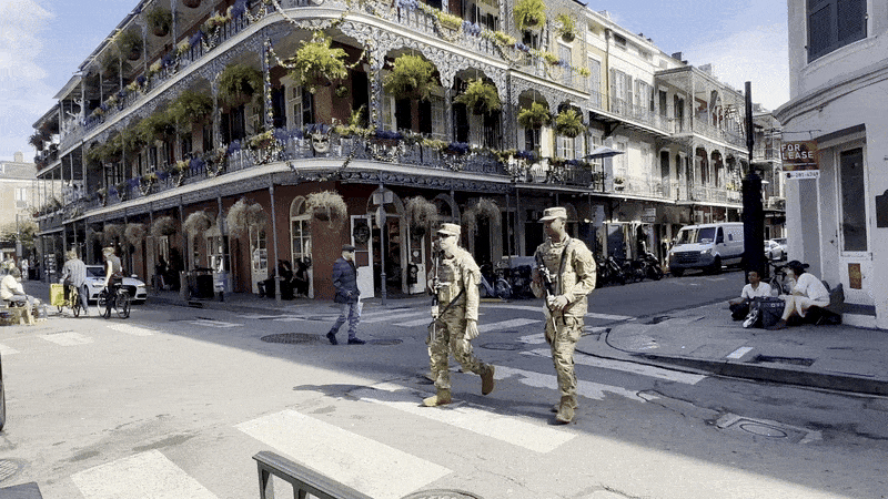 Image shows National Guardsmen patrolling the Quarter.