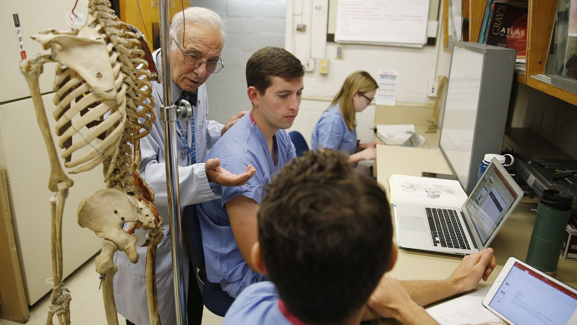 Med students talking to teacher