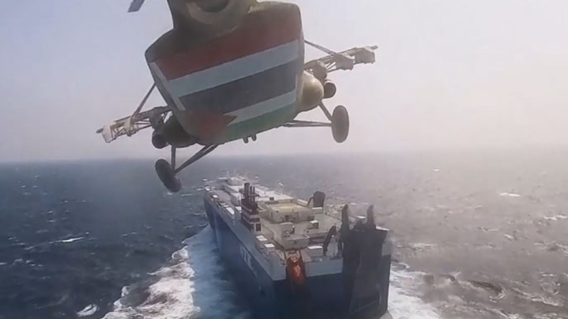 A screen grab captured from a video shows that cargo ship 'Galaxy Leader', co-owned by an Israeli company, being hijacked by Iran-backed Houthis from Yemen in the Red Sea on November 20, 2023. 