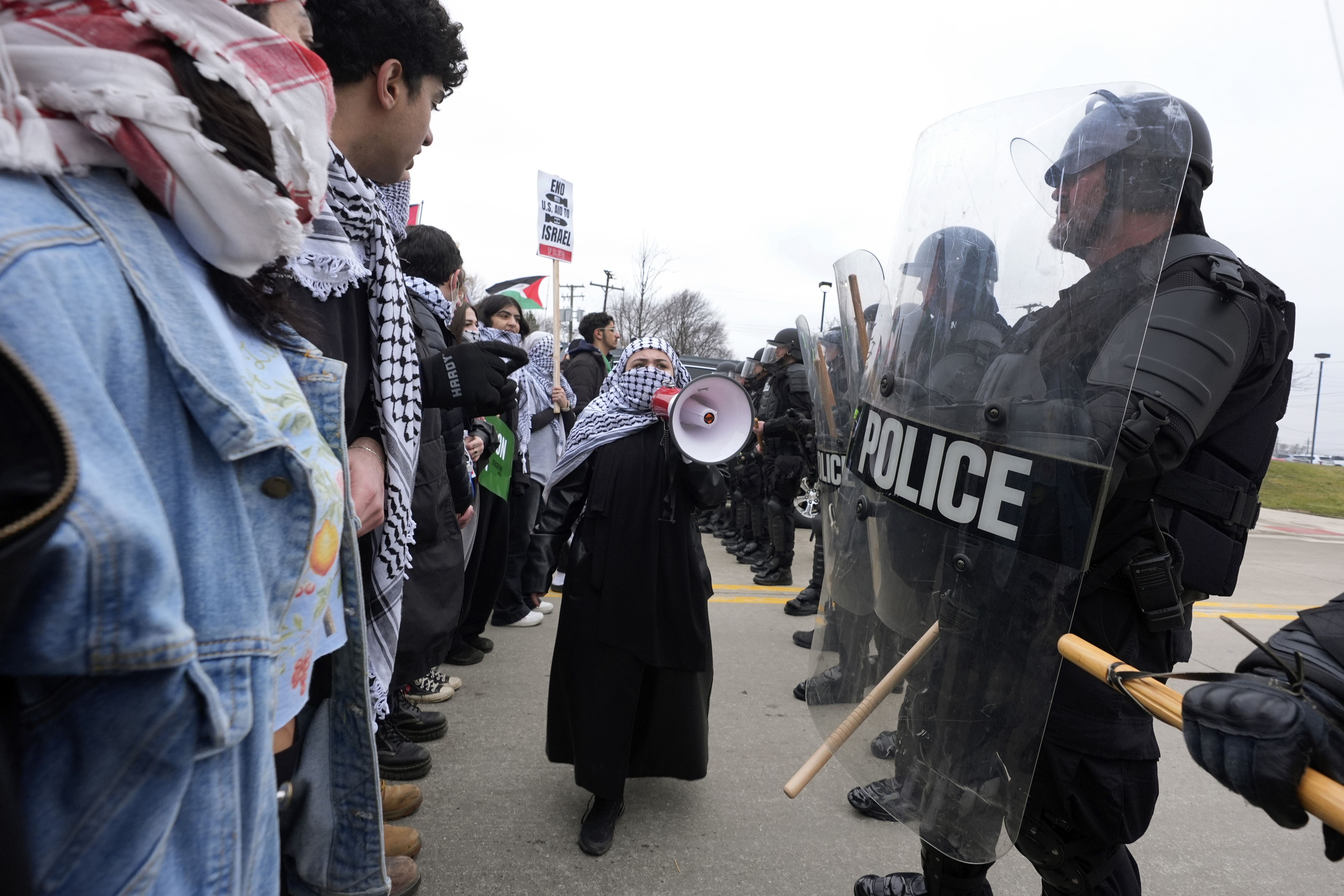 Pro-Palestinian demonstrators march against police during a visit by President Joe Biden in Warren, Mich., last week.