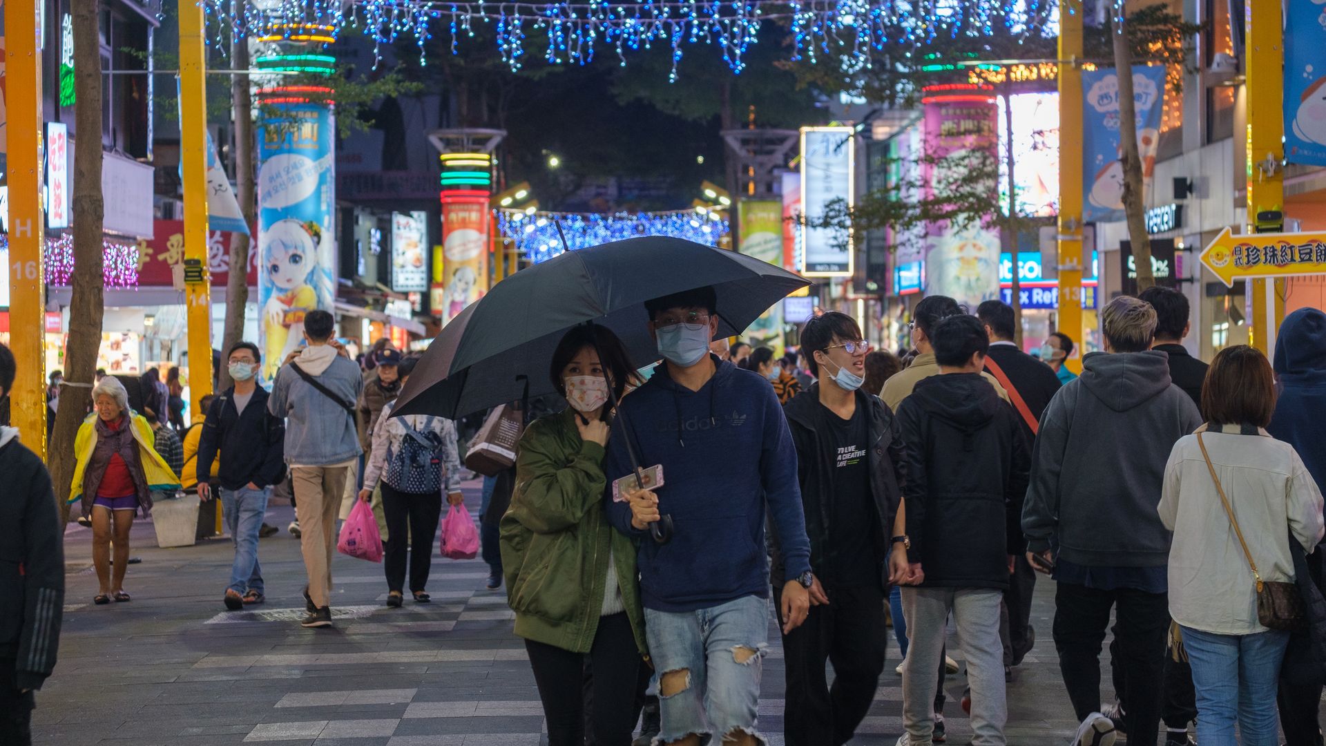 eople wearing face masks shop in Ximen, Taipei, Taiwan on December 05