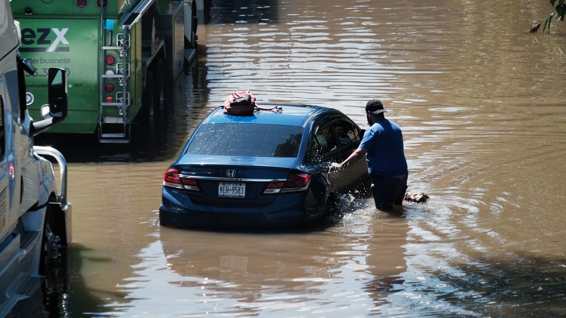 A car flooded in the middle of the street