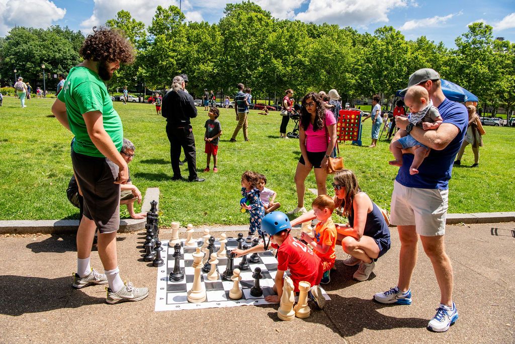 Families enjoy lawn games in Schenley Plaza during a Family Day celebration.