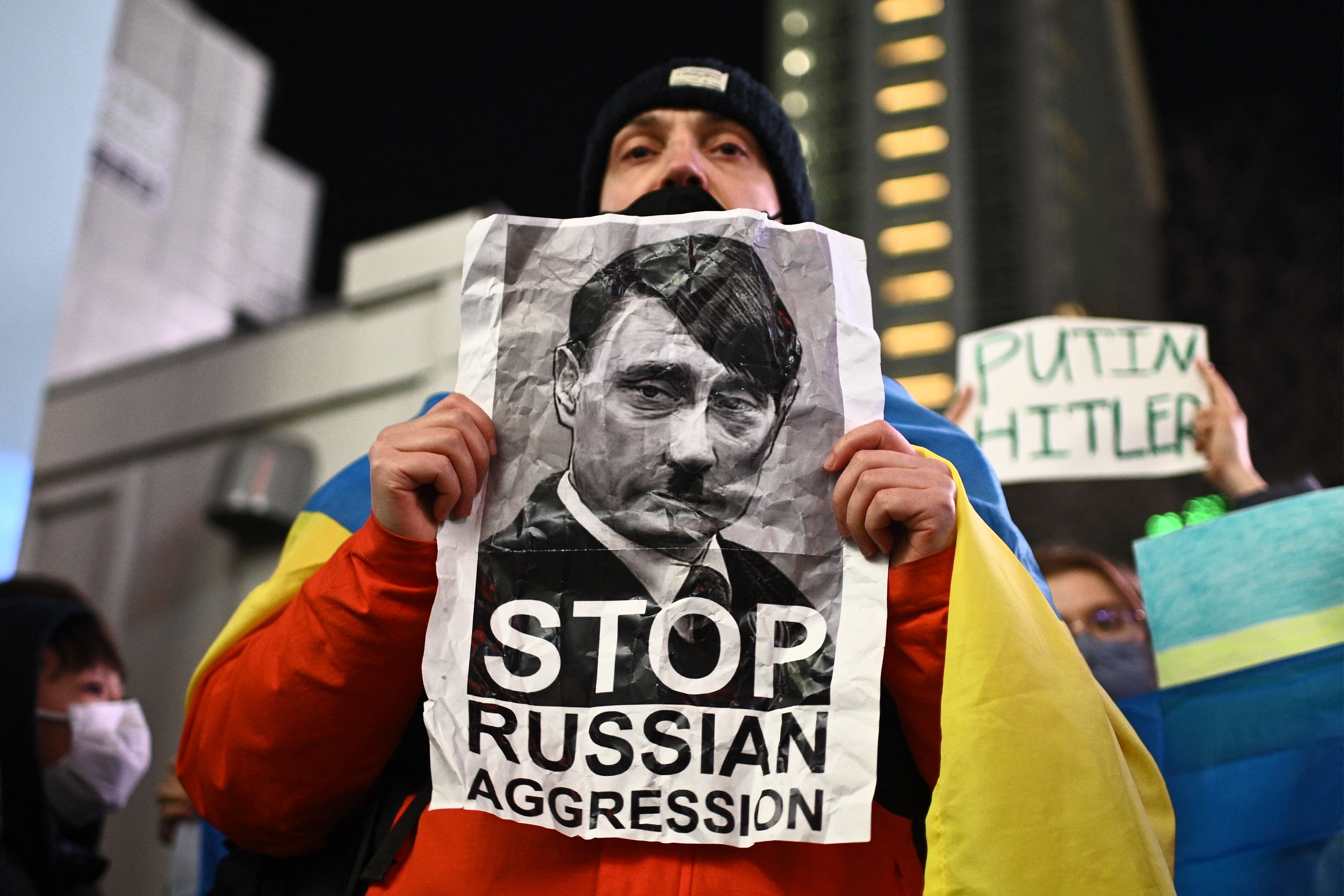 A man takes part in a protest against Russia's actions in Ukraine during a rally at Shibuya district in Tokyo on February 24.
