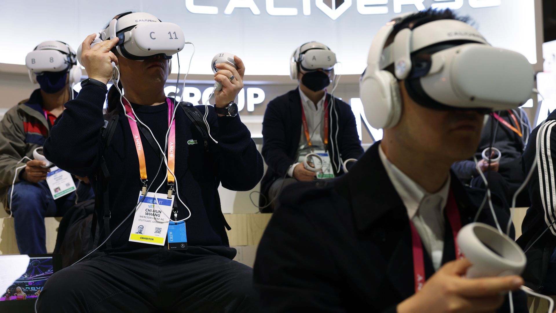 Attendees try out the Caliverse Hyper-Realistic Metaverse experience at the Lotte booth at CES 2023 at the Las Vegas Convention Center on January 5, 2023 in Las Vegas, Nevada.