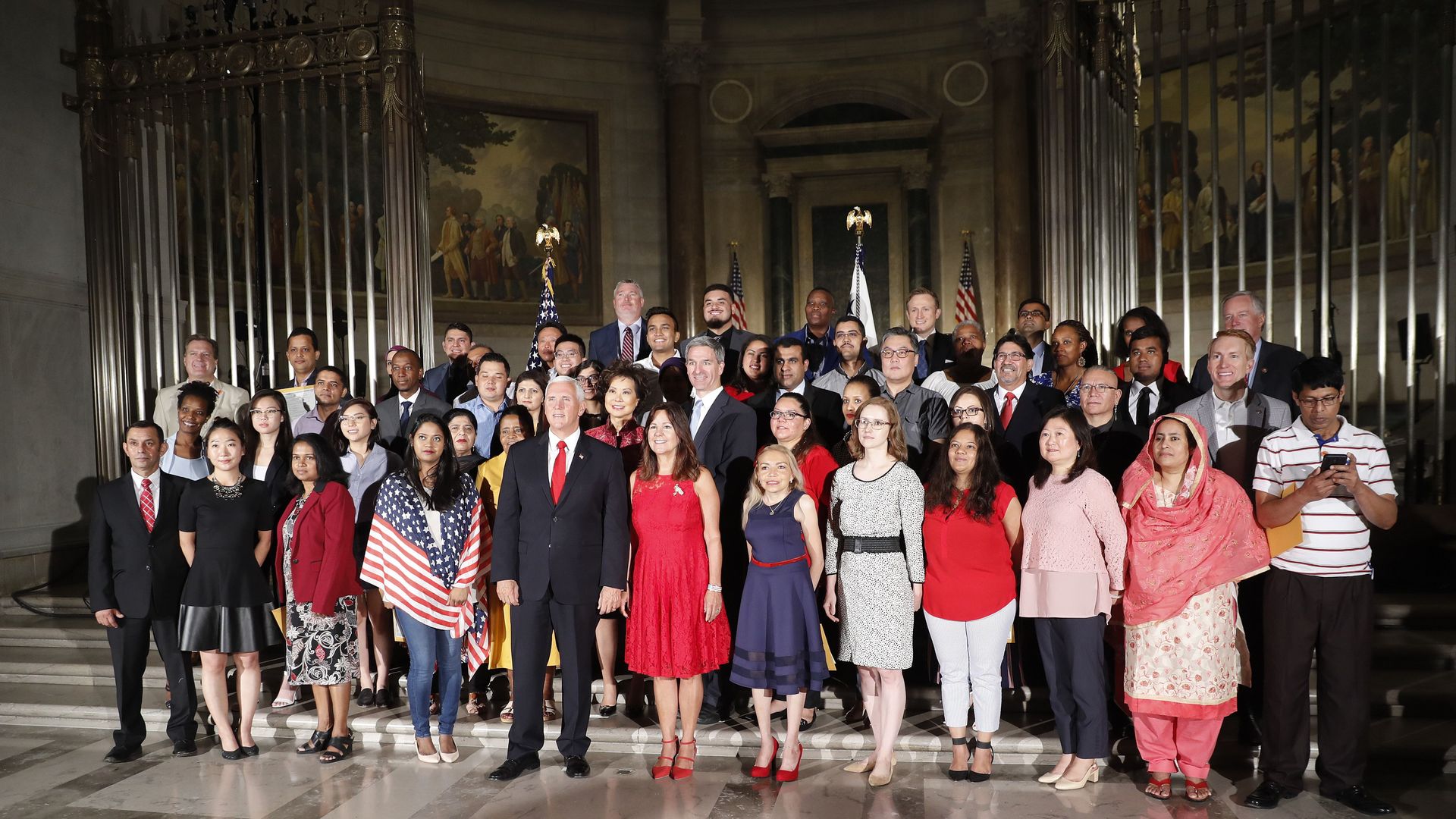 Last July 4, Vice President Pence and Karen Pence posed with new Americans after a naturalization ceremony at the National Archives