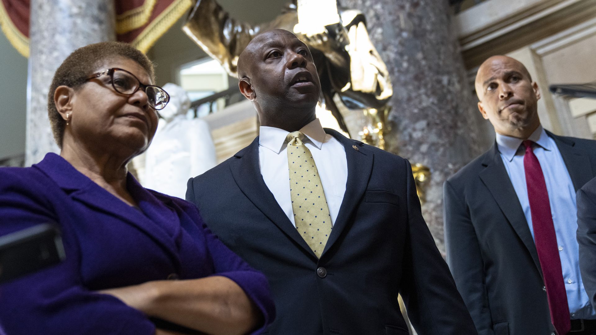 Rep. Karen Bass (D-Calif.) with Sens. Tim Scott (R-S.C.) and Cory Booker (D-N.J.) in the Capitol in May 2021.