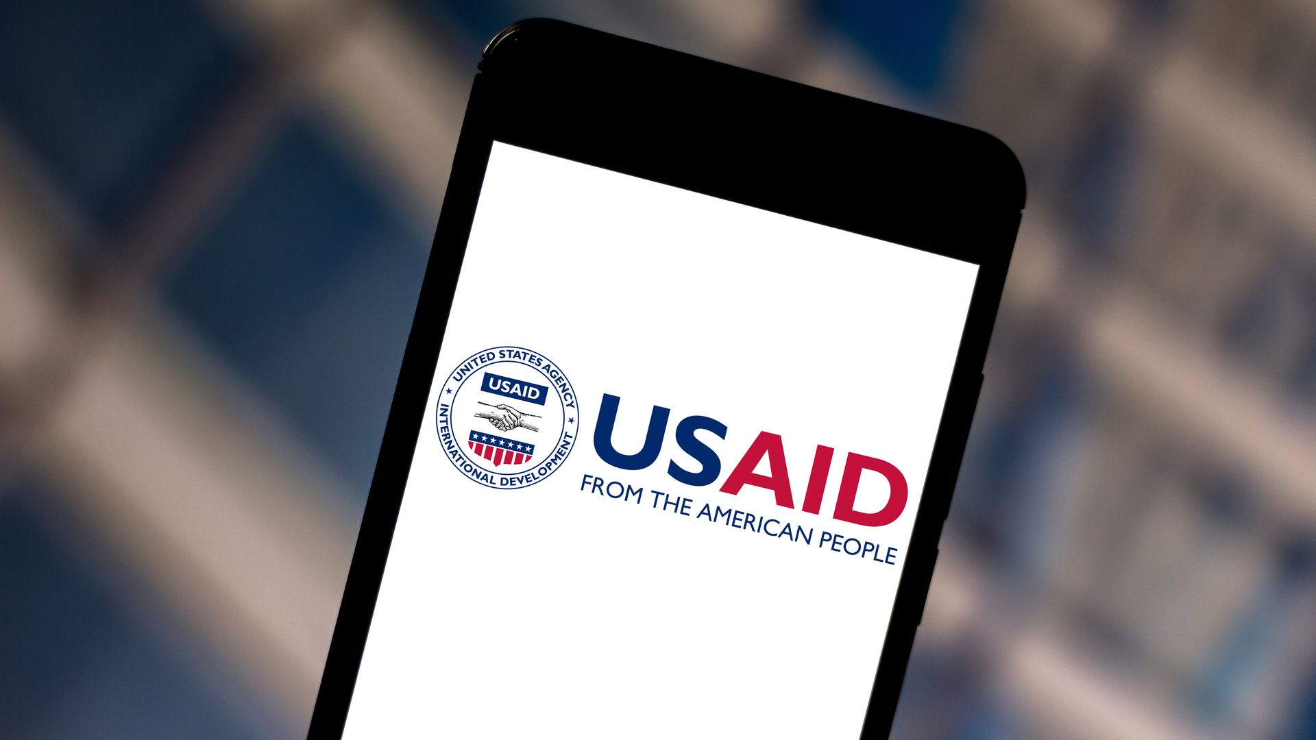 USAID's logo displayed on a phone screen.