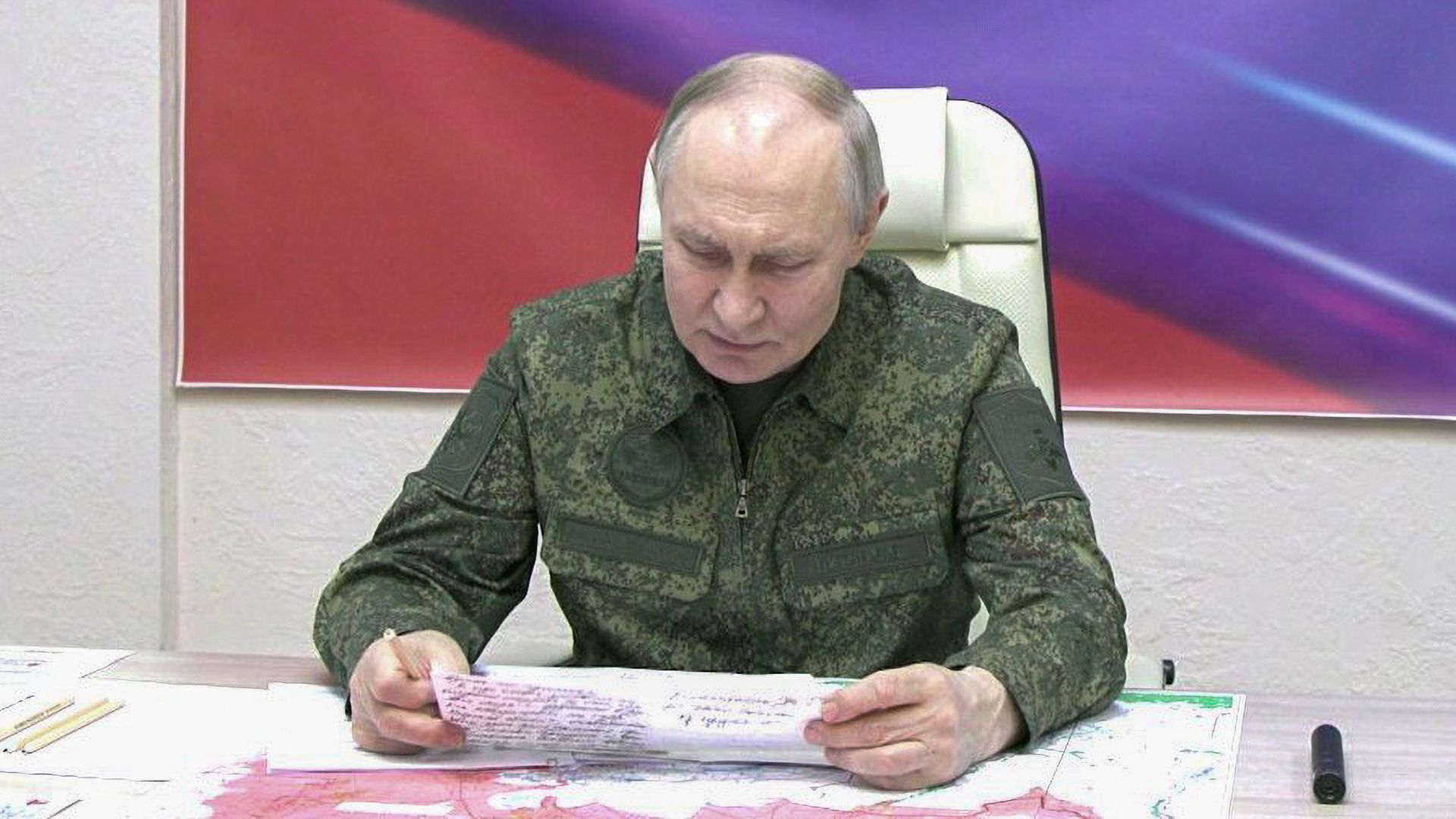 Putin with paper