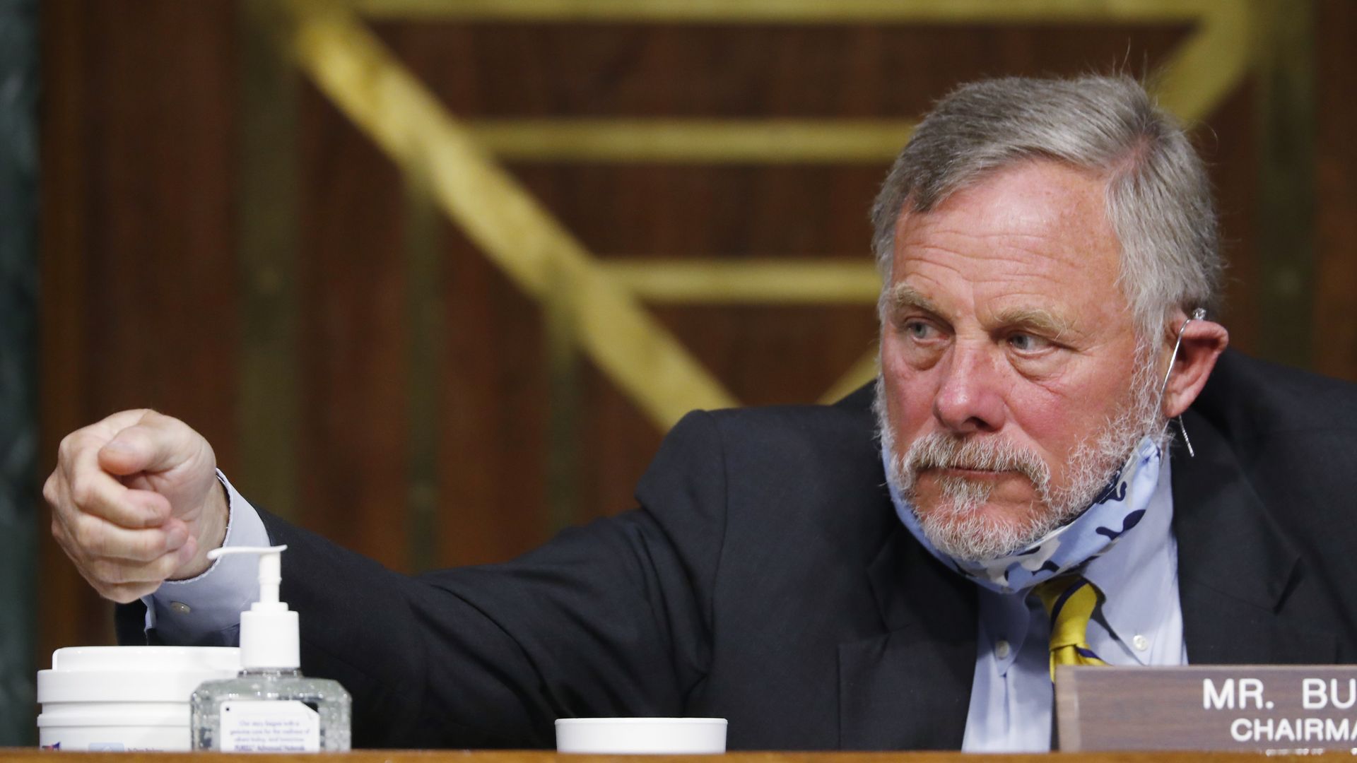  Chairman Richard Burr, R-N.C., reaches for hand sanitizer at a Senate Intelligence Committee nomination hearing for Rep. John Ratcliffe, R-Texas, on Capitol Hill in Washington, Tuesday, May. 5