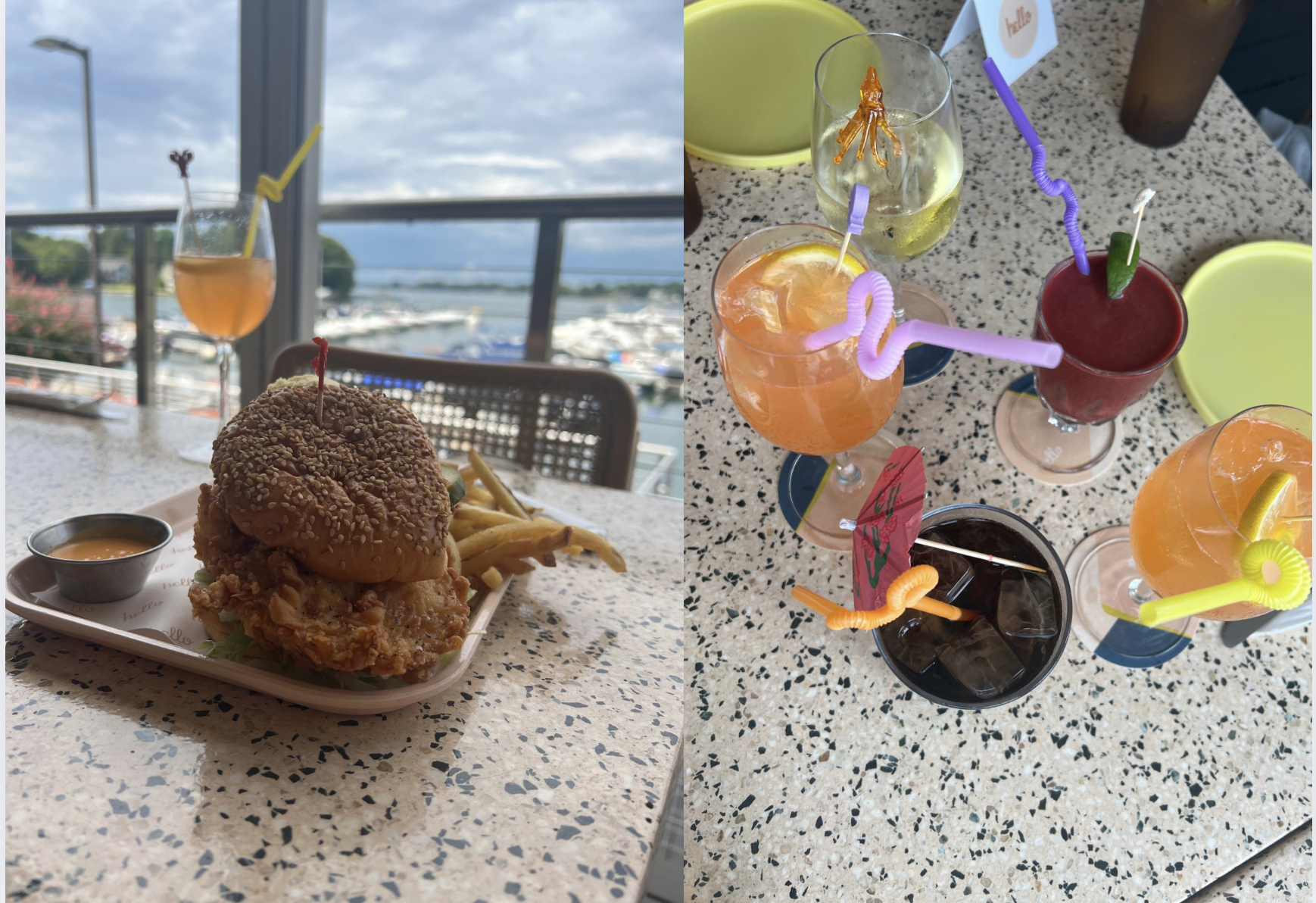 A sesame seed chicken sandwich with fries and sauce on a table by a marina window. Five colorful cocktails with straws, umbrellas, and garnishes on a speckled table.