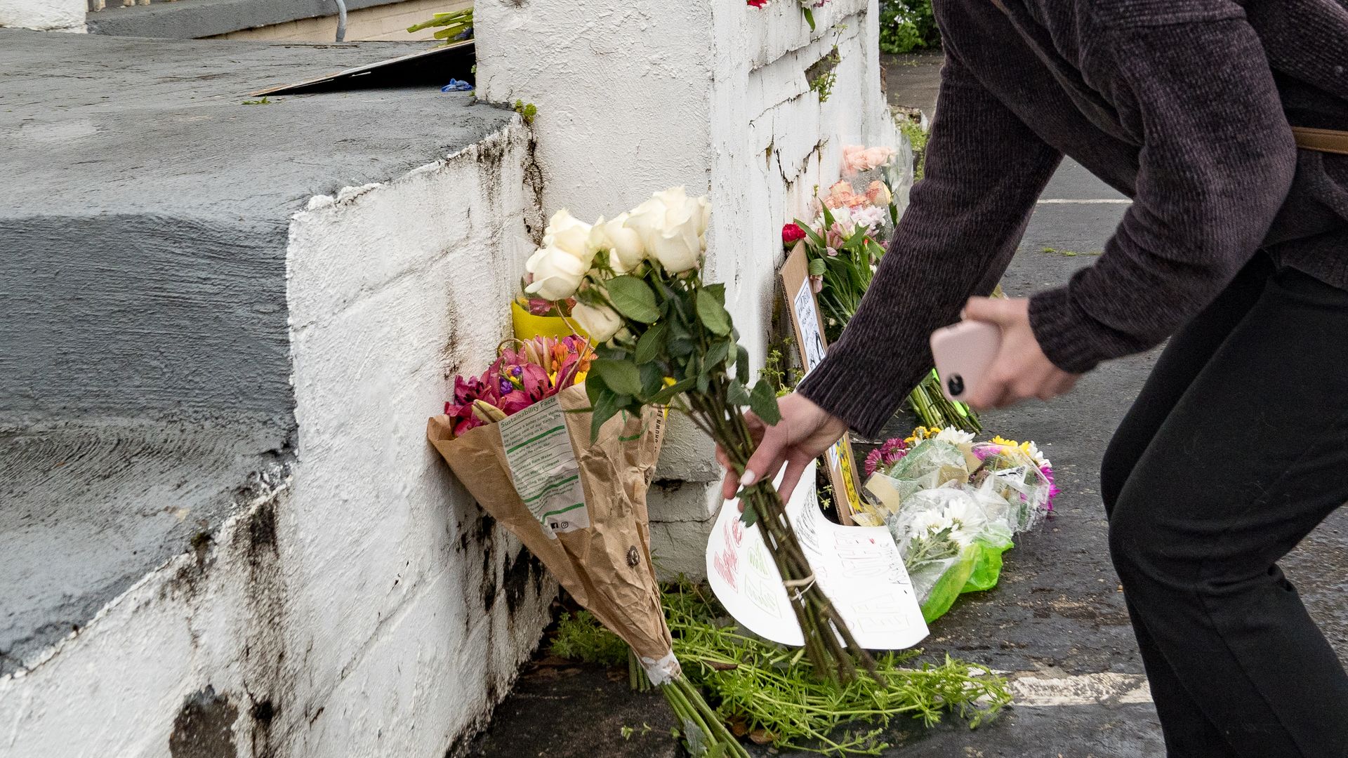 Mourners leave flowers for the victims of the Georgia shooting. Photo: Megan Varner/Getty Images