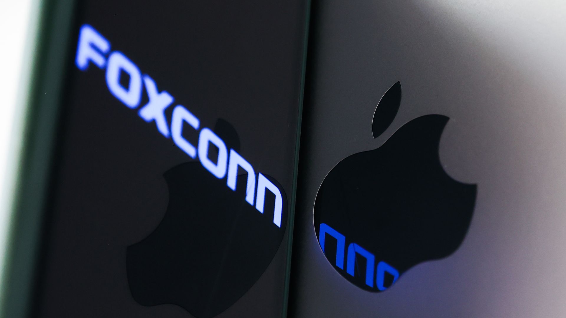  Foxconn logo displayed on a phone screen and Apple logo on a laptop are seen in this illustration photo taken in Krakow, Poland on November 2, 2022. 