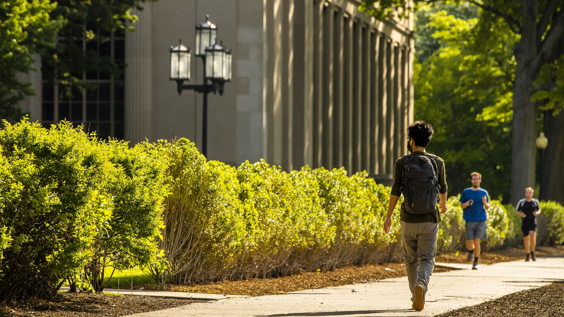 A student walks through the Massachusetts Institute of Technology (MIT) campus