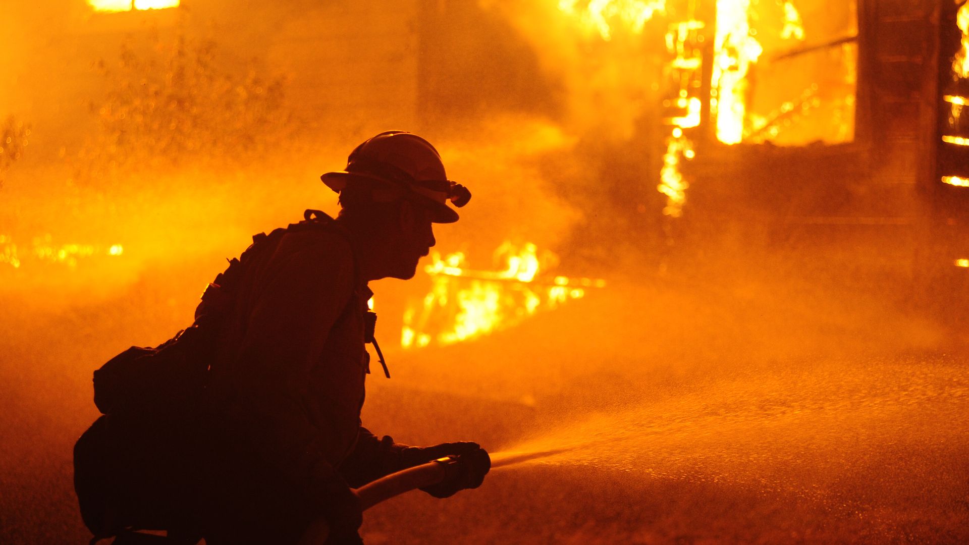 Firefighters try to extinguish Dixie Fire near Chico in Greenville, California, United States on August 5