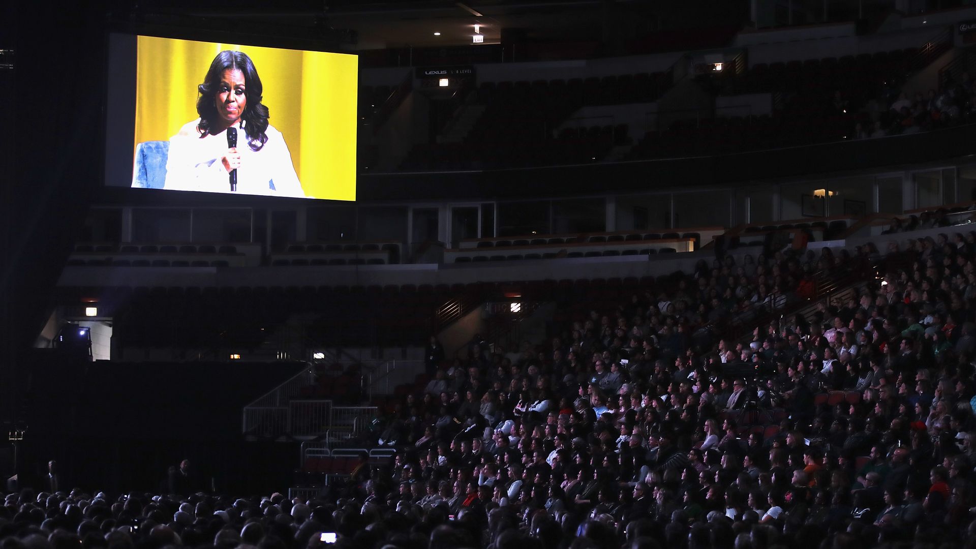 Guests watch as Oprah Winfrey interviews former first lady Michelle Obama as she kicks off her 'Becoming' arena book tour las month in Chicago, Illinois.