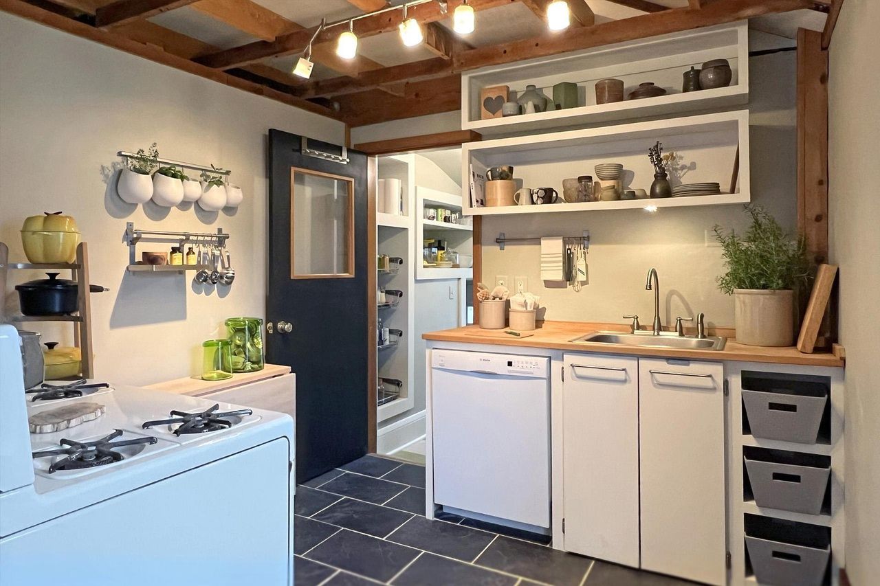kitchen and walk-in pantry in tiny home