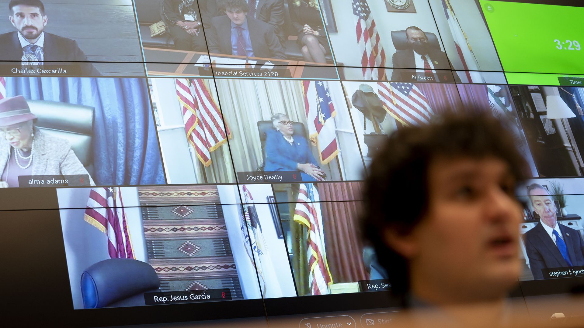 Photo of a screen showing Congress members calling in from their office