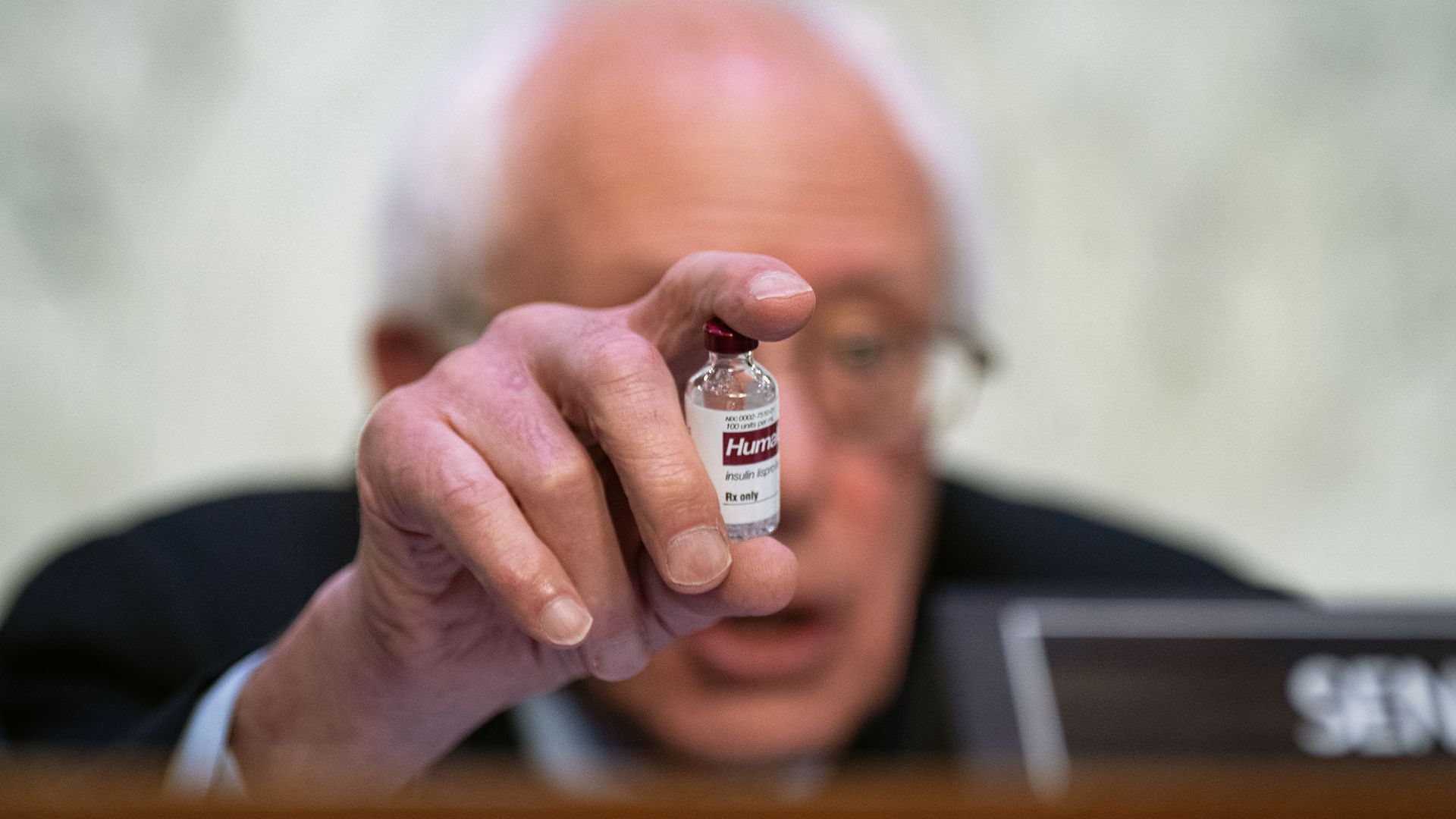 Photo of Bernie Sanders holding up a bottle of insulin.