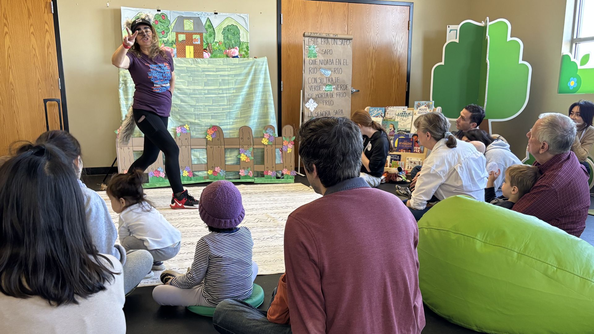 An educator holds a puppet show for toddlers and young children at Duo's Treehouse early learning center in Pittsburgh