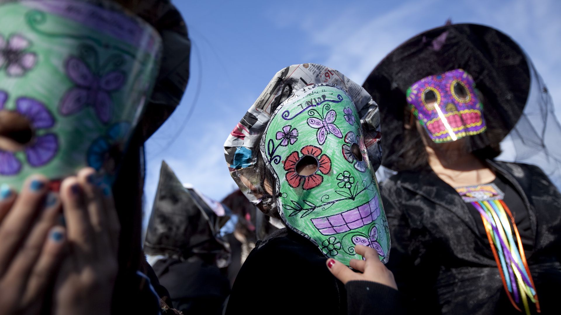 A photo of children in Day of the Dead masks