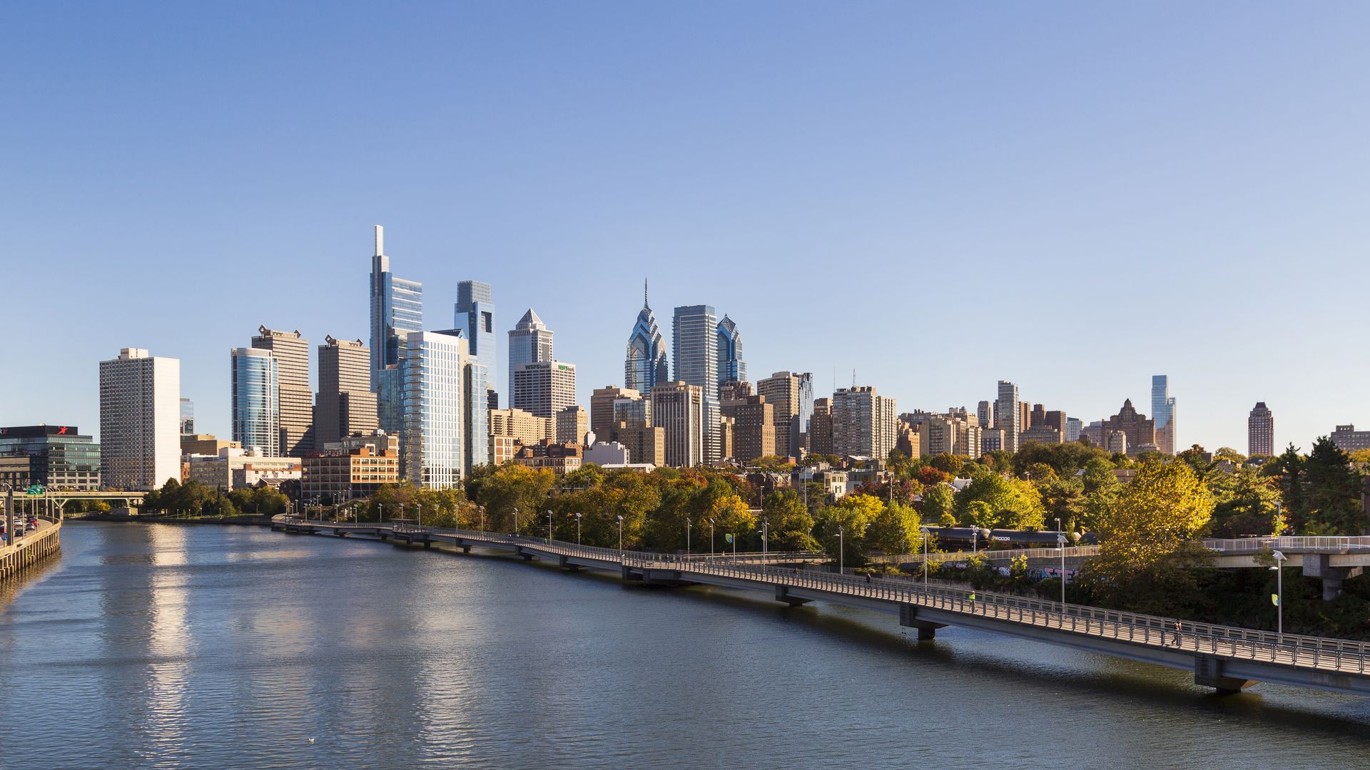 The Philadelphia skyline in the autumn behind the Schuylkill River Boardwalk. 