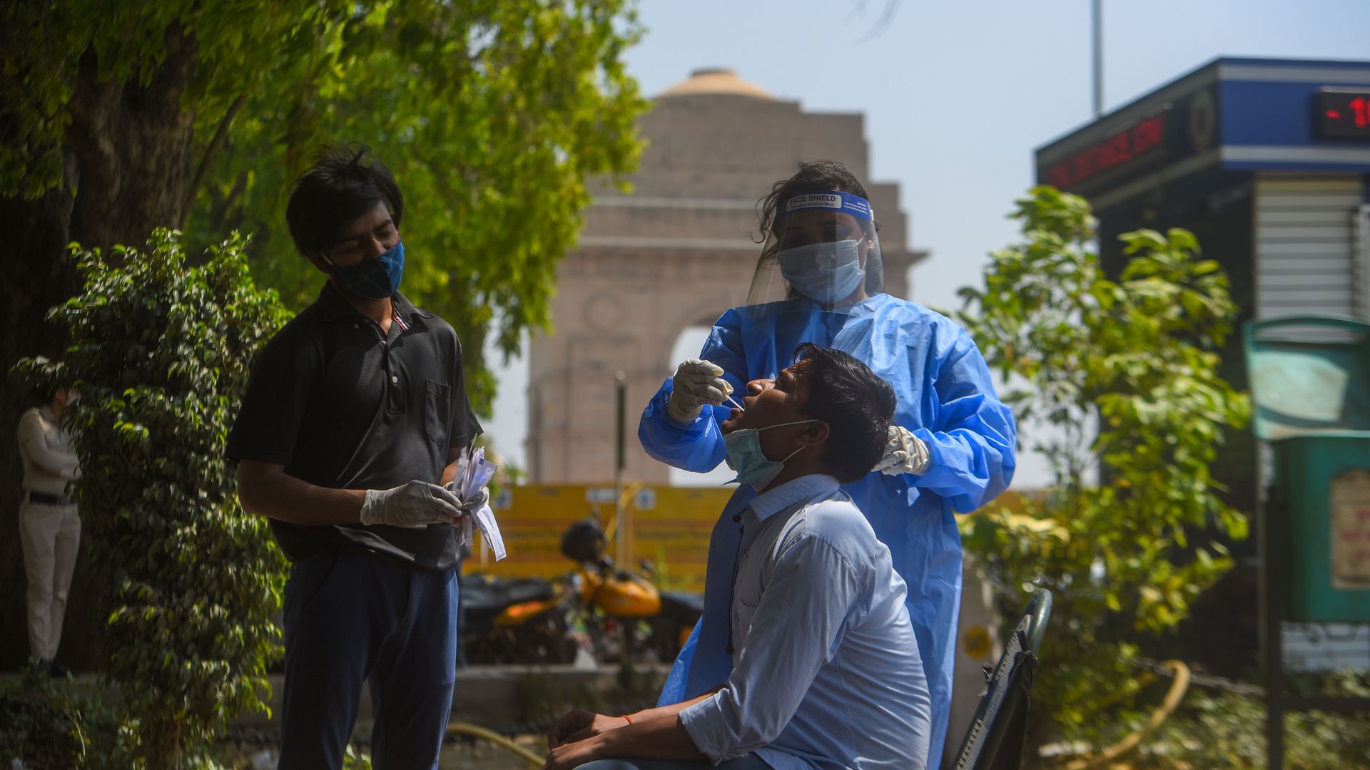 A health worker collecting a swab sample from a person for coronavirus (Covid-19) testing at India Gate, on April 4, 2021 in New Delhi, India.