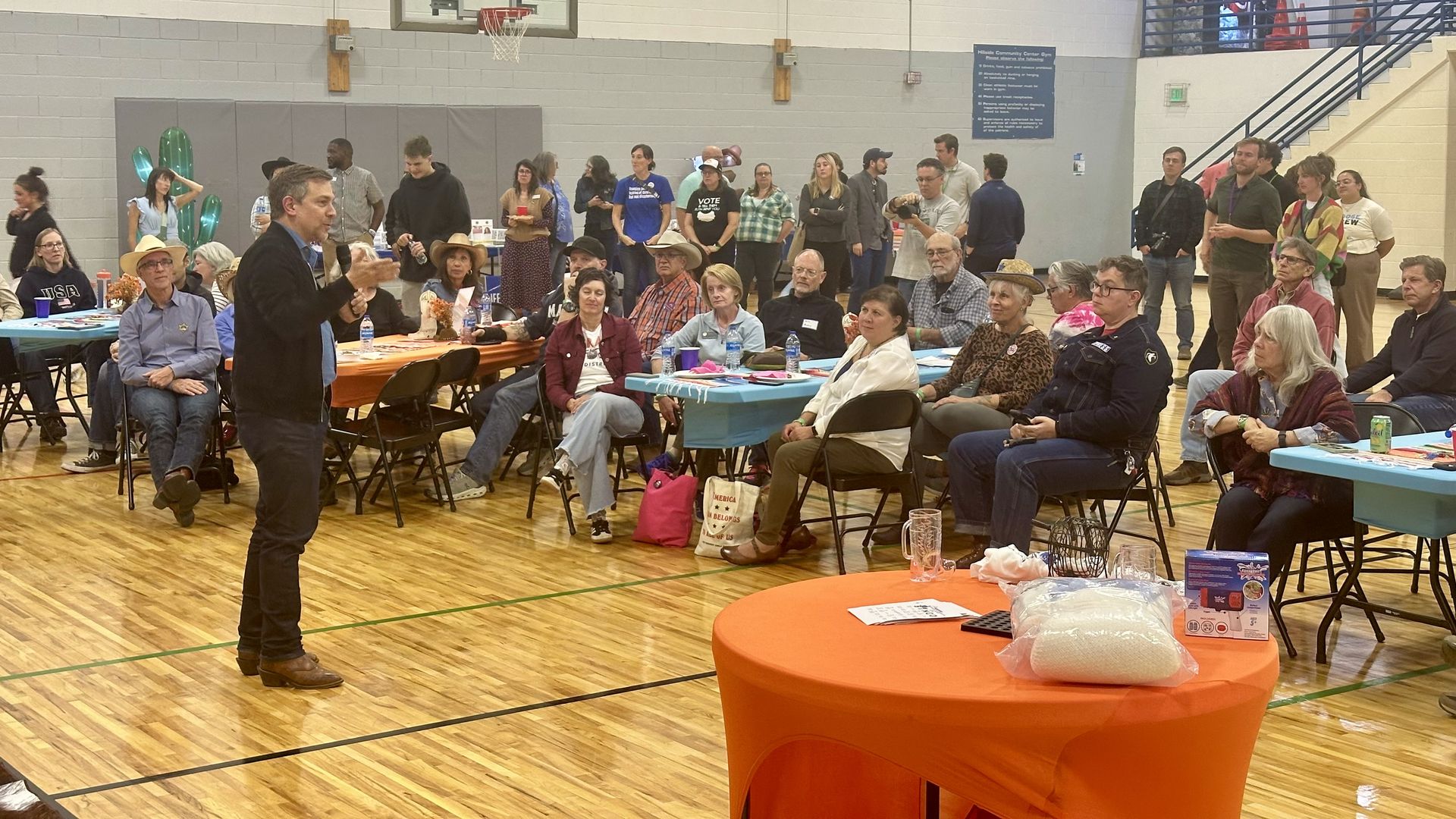 Democratic nominee for state treasurer, Jeff Bridges, talks to voters at a Democratic rally Sunday in Colorado Springs. Photo: John Frank/Axios
