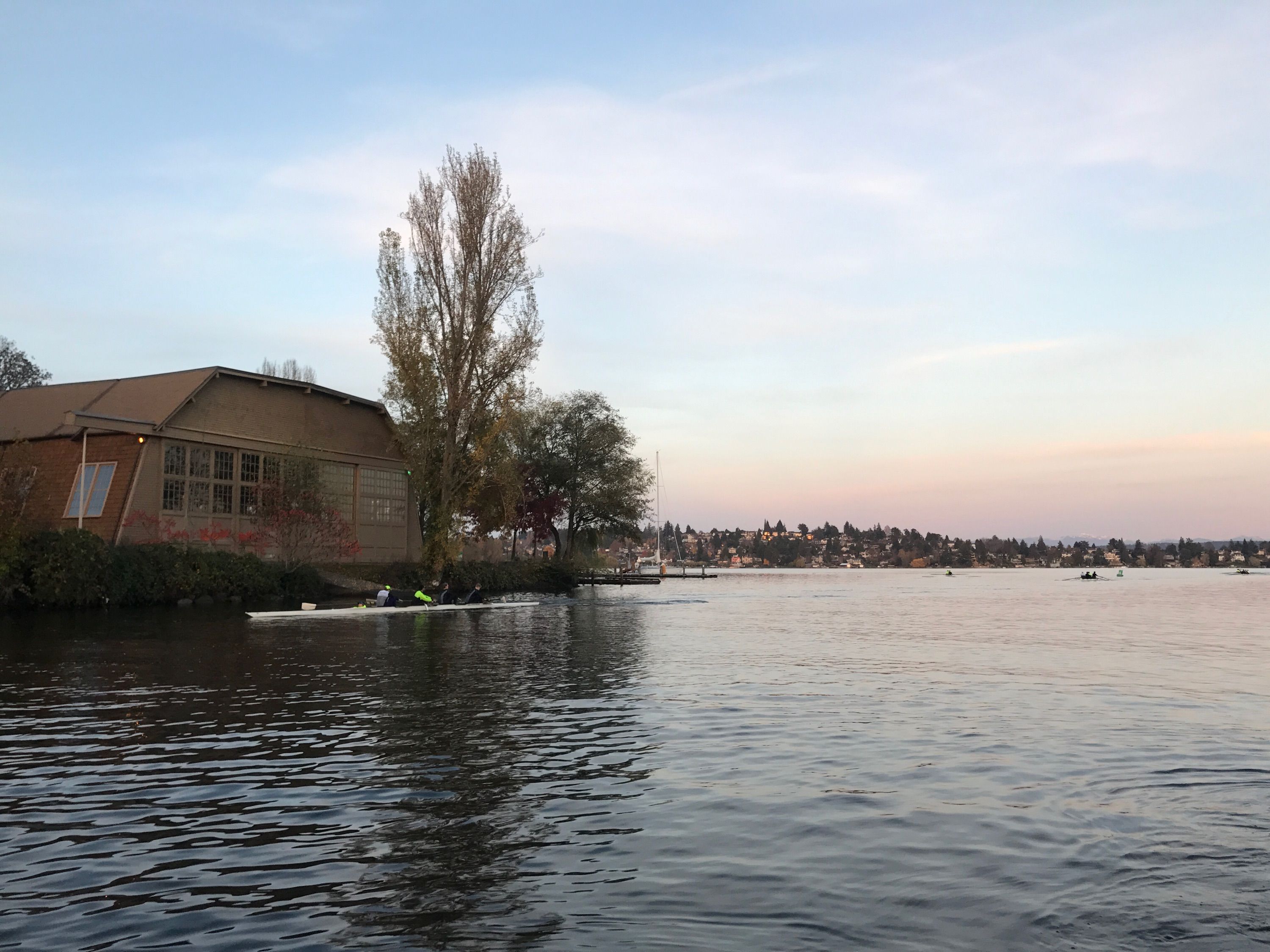 A wooden hangar sits on the edge of Seattle's Montlake Cut. 