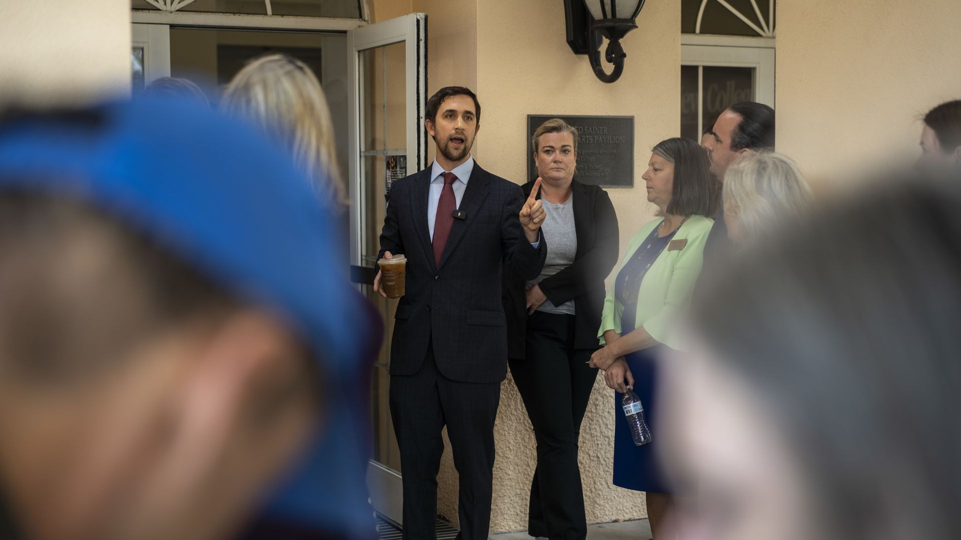 Christopher Rufo enters a room