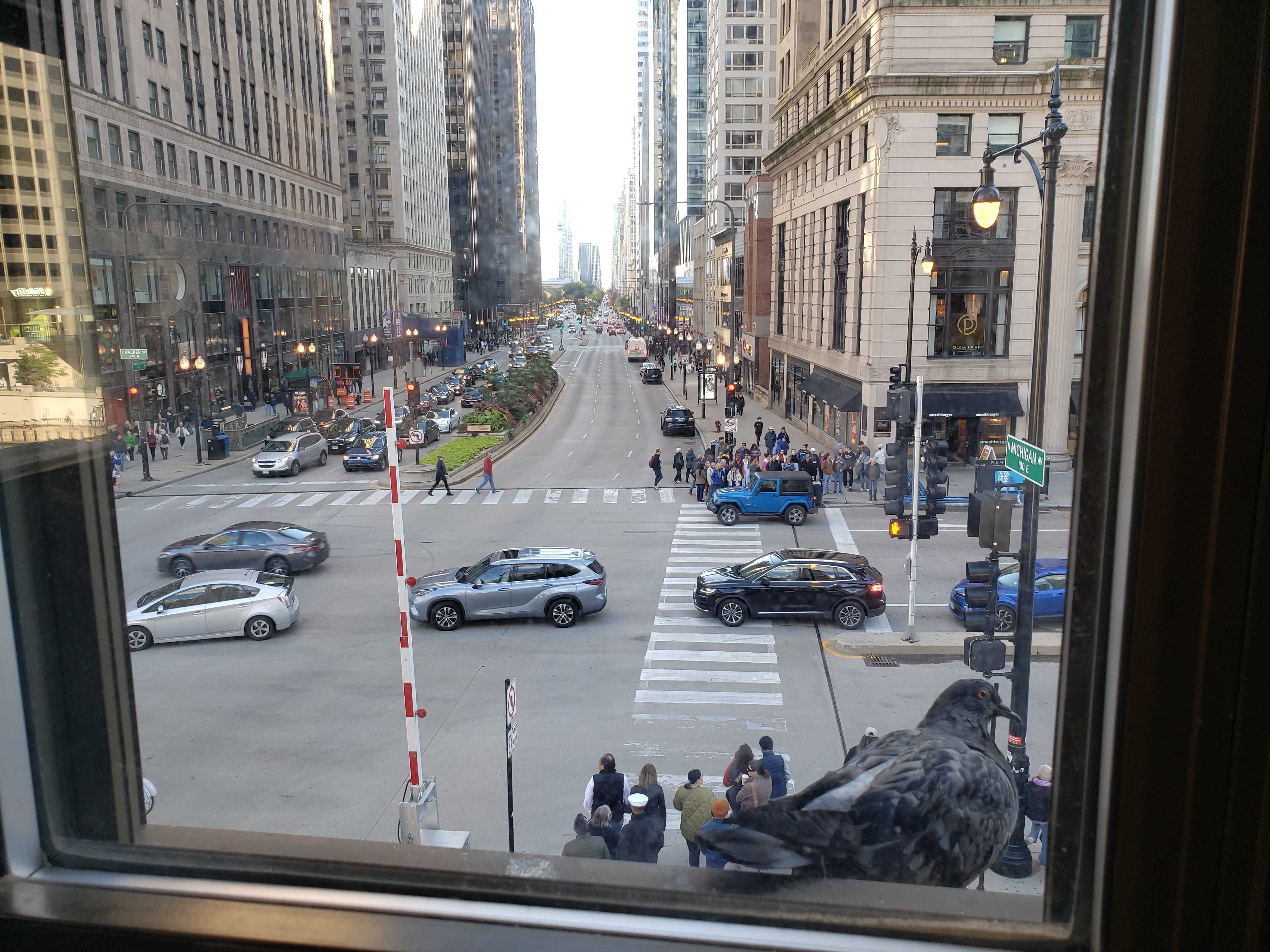 Photo of traffic from a window. 