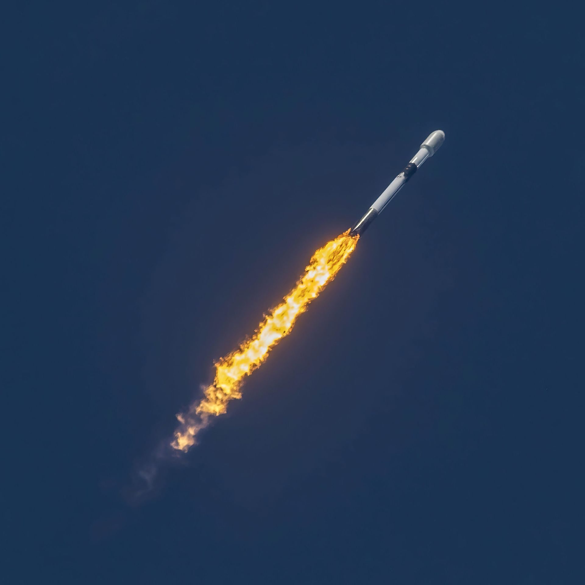 A Falcon 9 rocket carrying Starlink satellites to orbit