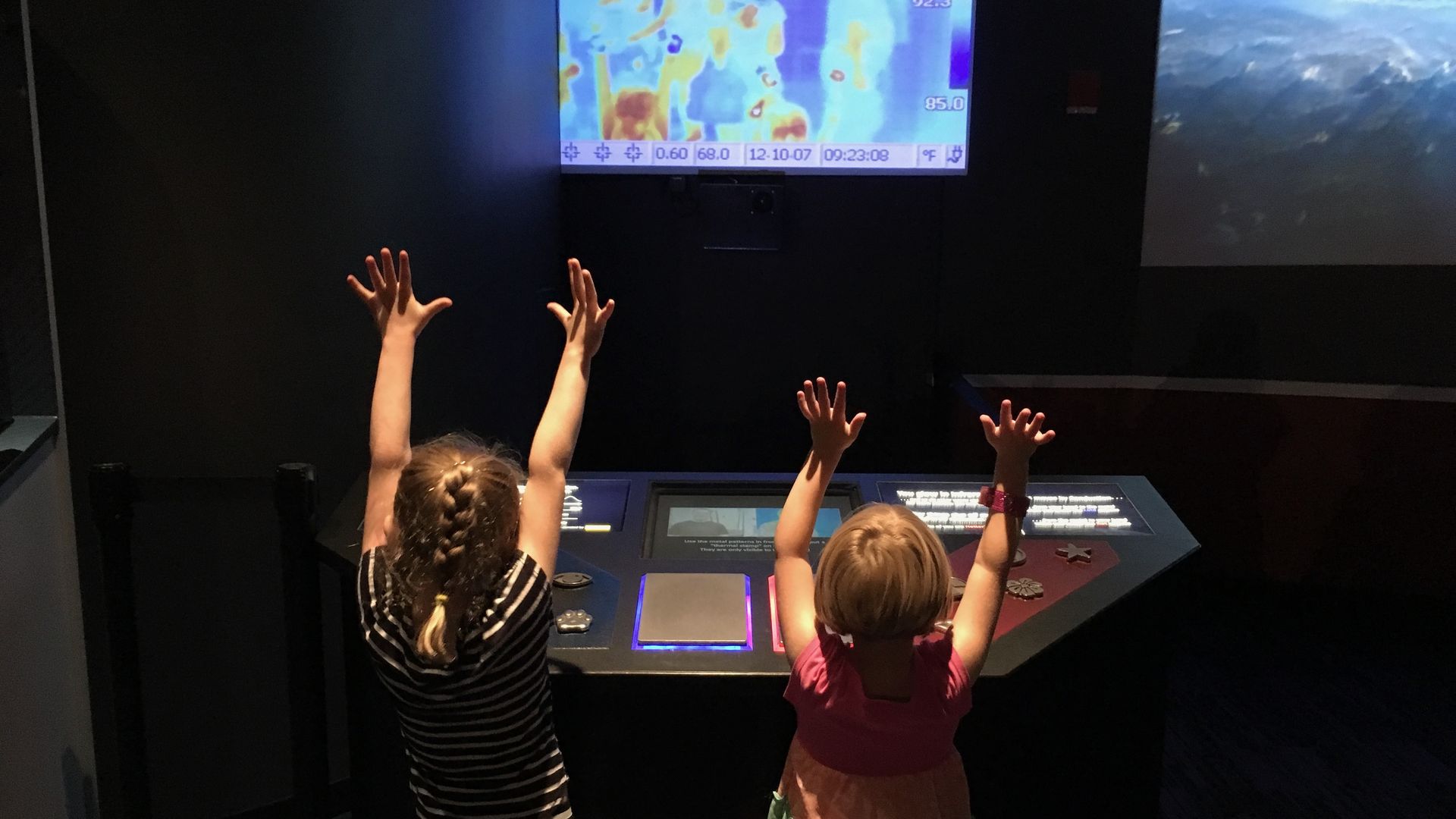 Children play with a heat-sensing camera at Clark Planetarium. Photo: Erin Alberty/Axios