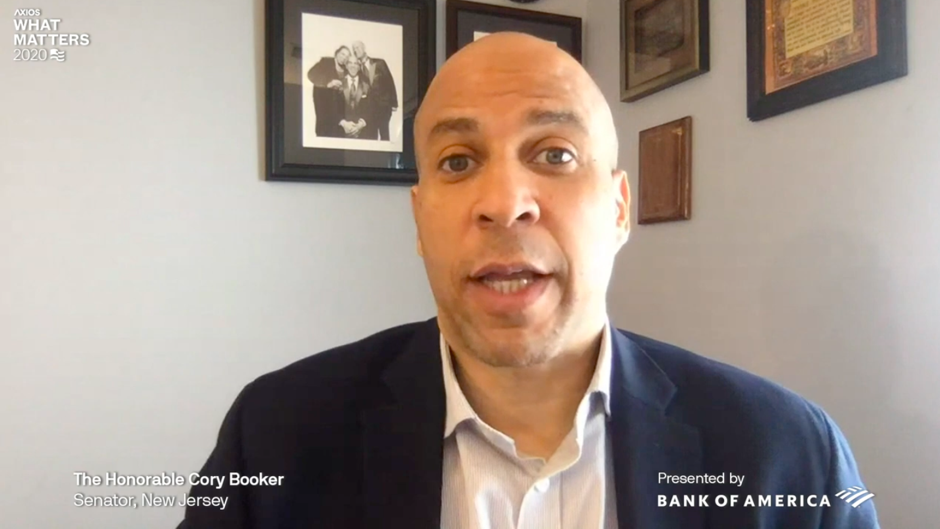 Screenshot of Cory Booker wearing a suit and dress shirt