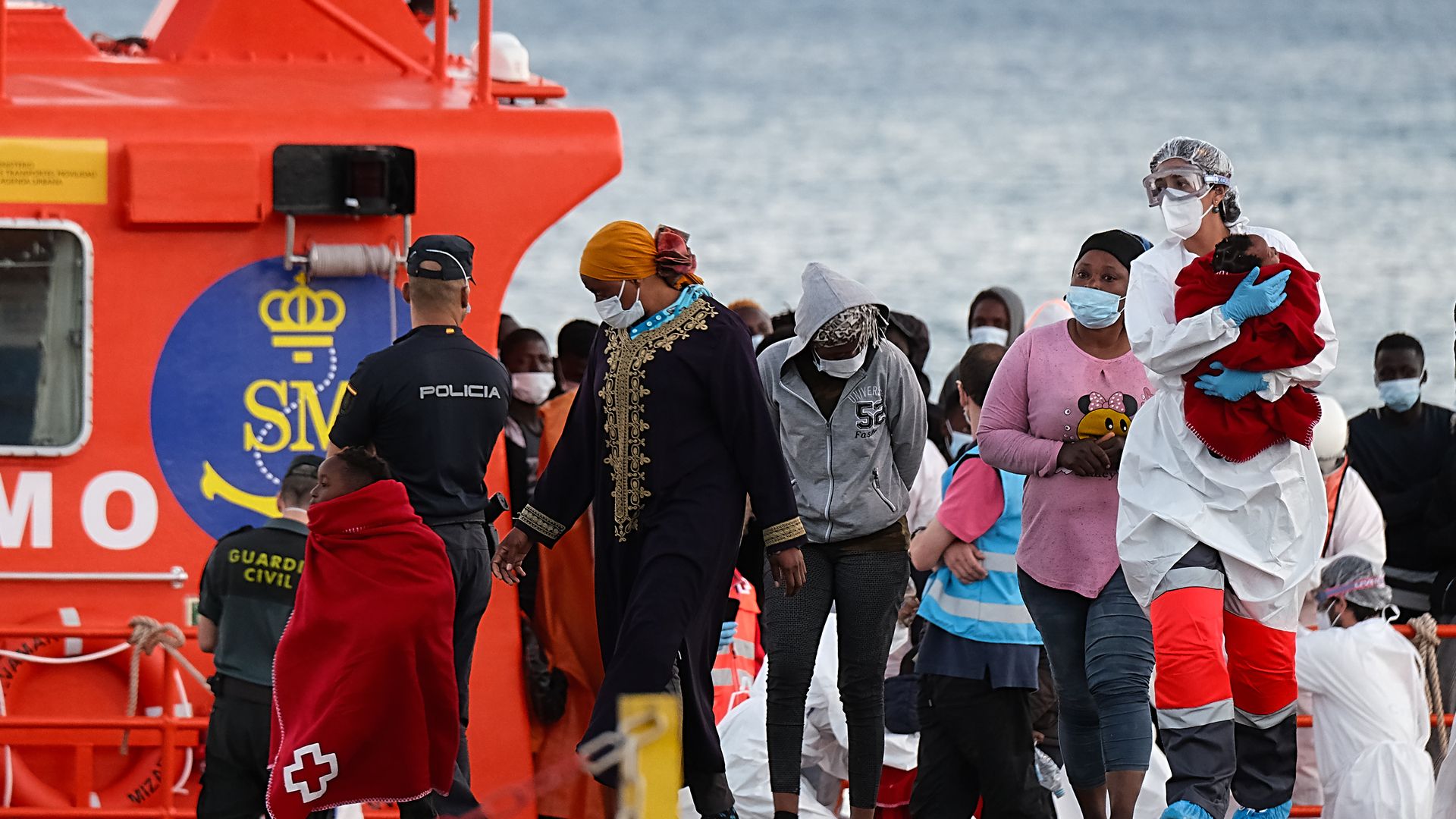 Sub-Saharan migrants disembark in the Canary Islands after being rescued at sea