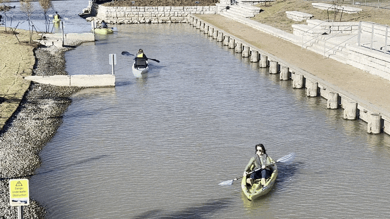 Image shows a woman kayaking.