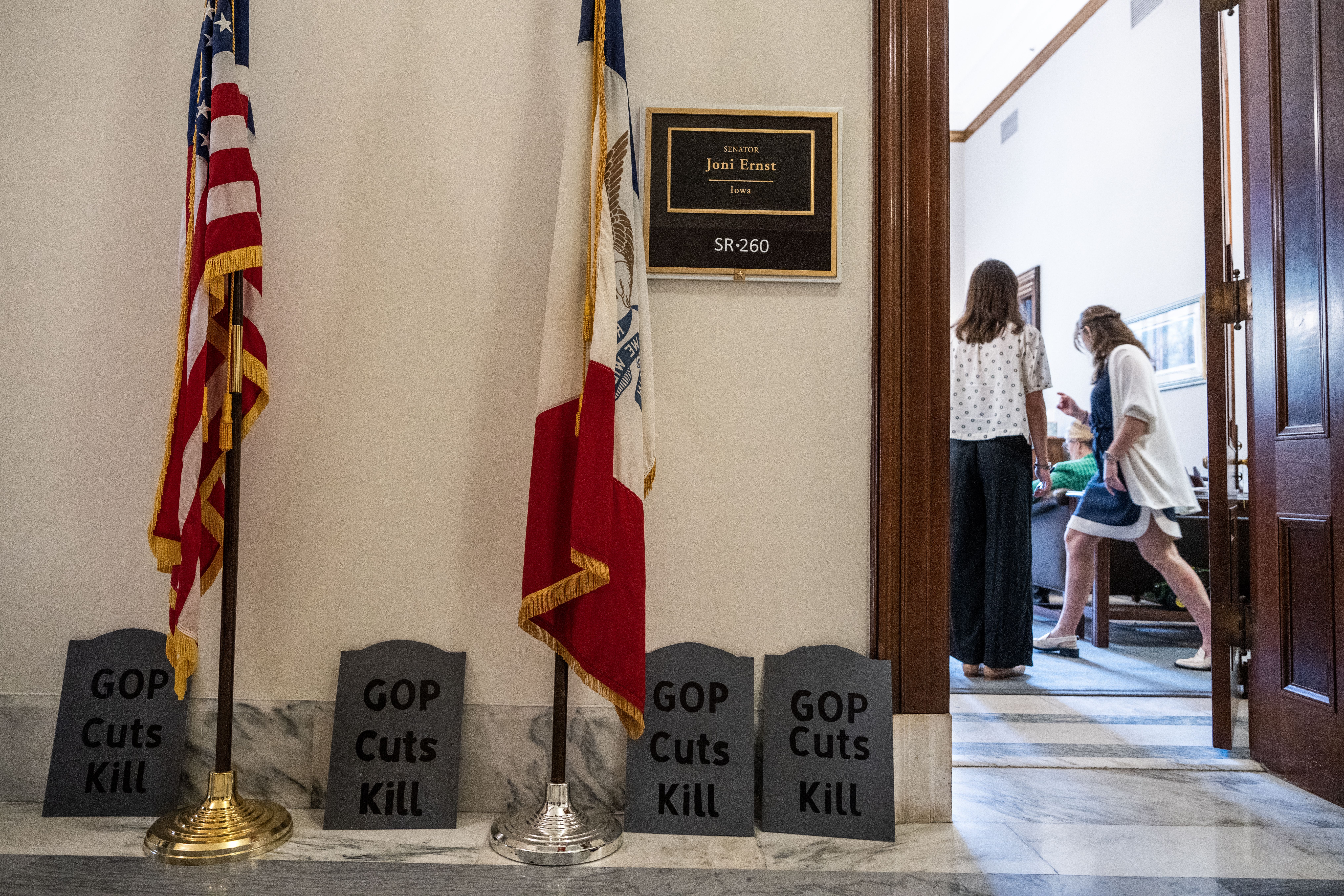 A photo of cardboard tombstones outside Joni Ernst's office.