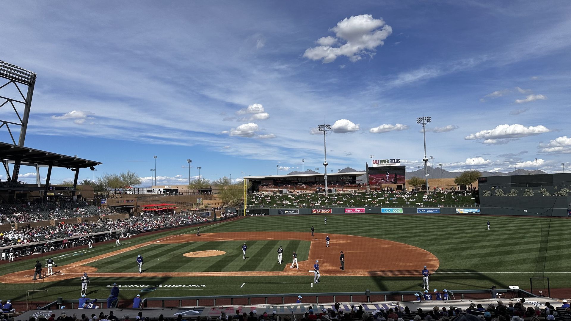 A photo of the Arizona Diamondbacks spring training facility and game against the Texas Rangers