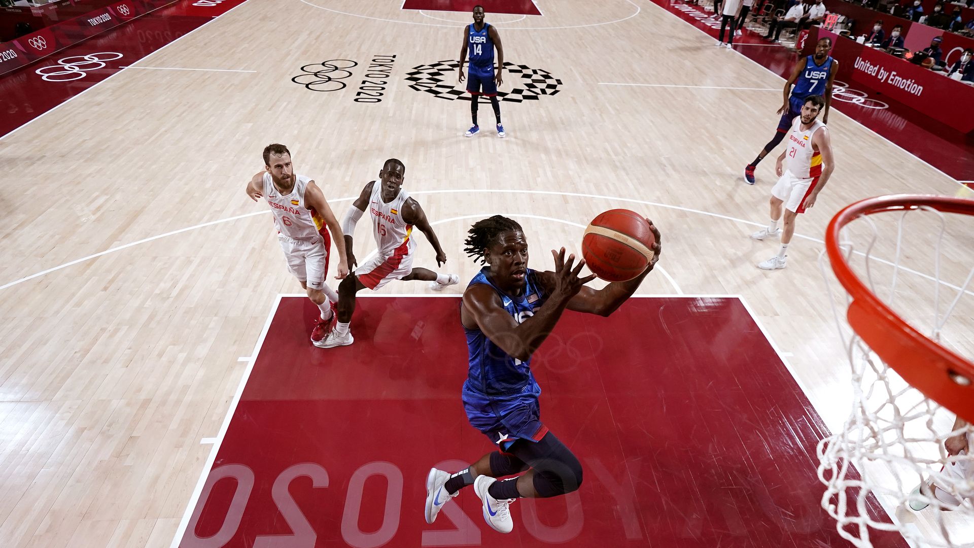 US' Jrue Holiday #12  drives to the basket against Team Spain during the second half of a Men's Basketball Quarterfinal game on day eleven of the Tokyo 2020 Olympic Games