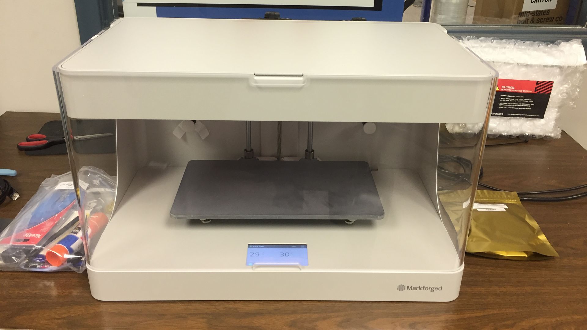 Image of a 3D printer involved in manufacturing PPE