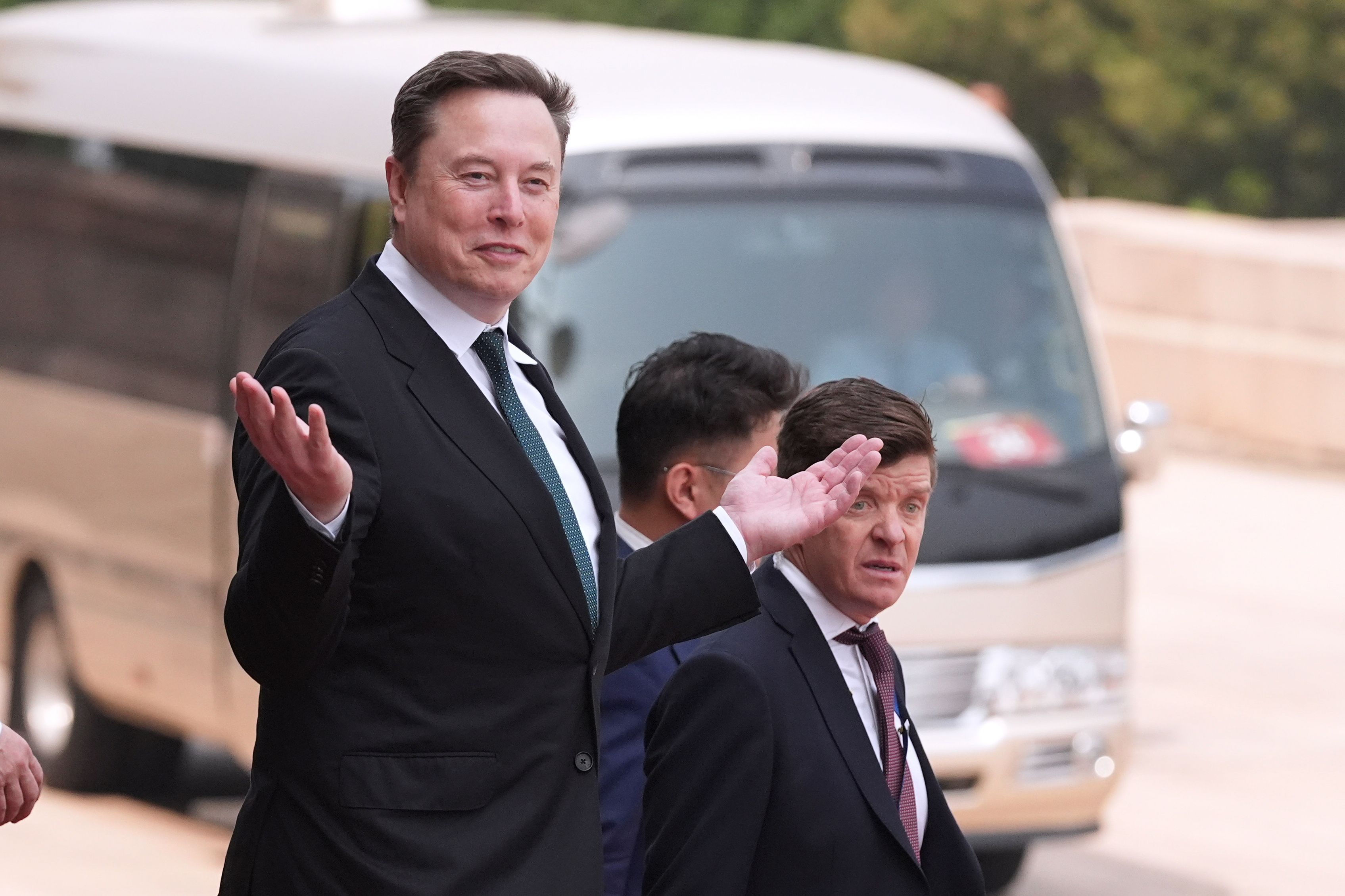 Elon Musk departs after a welcome ceremony with President Donald Trump and China's President Xi Jinping at the Great Hall of the People, Thursday, May 14, 2026, in Beijing. (AP Photo/Mark Schiefelbein)
