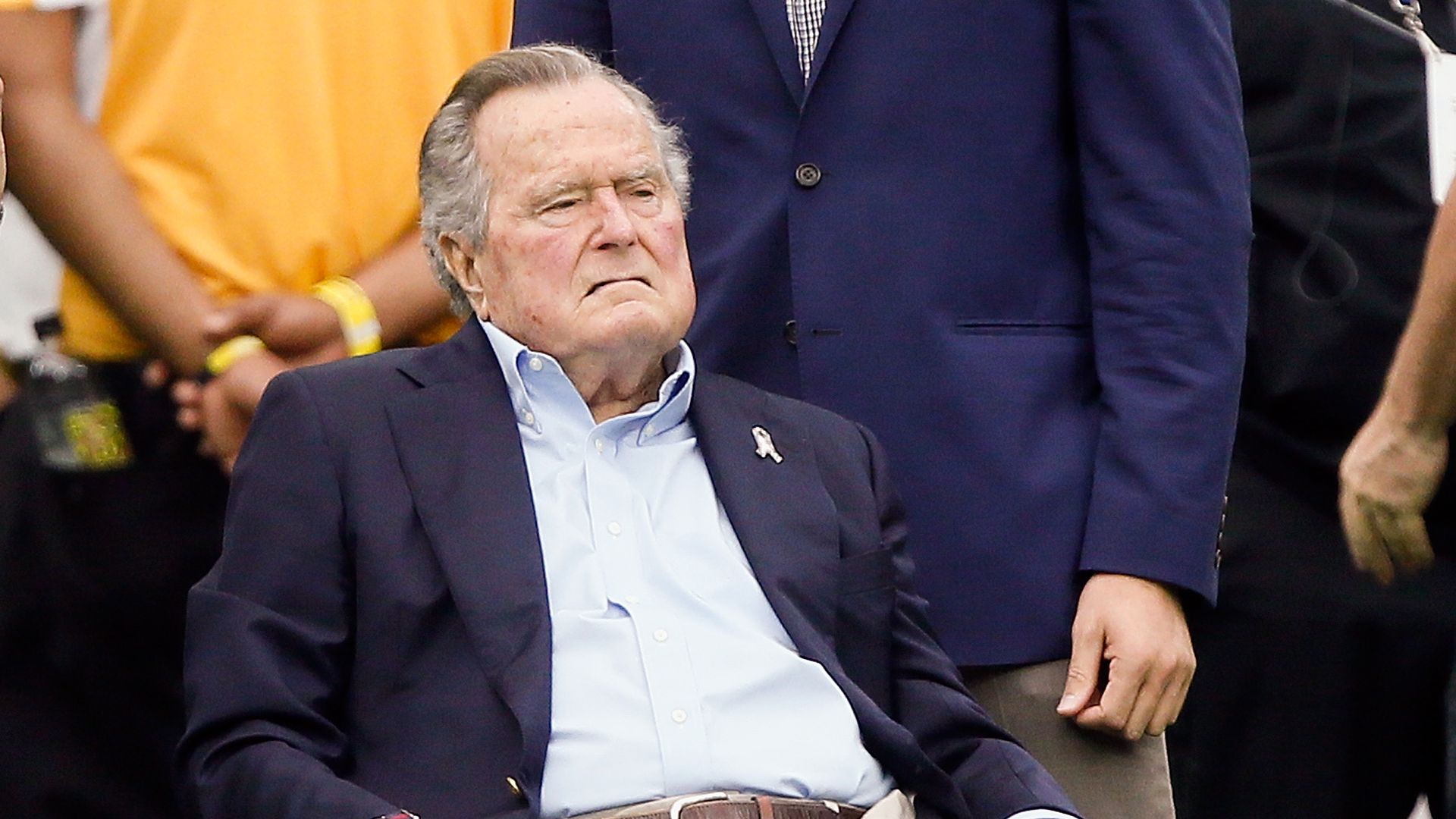 George H.W. Bush sitting in a wheelchair