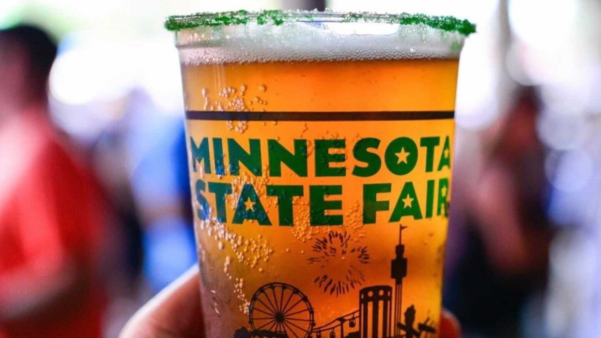A photo of a full beer in a plastic cup that says Minnesota State Fair.